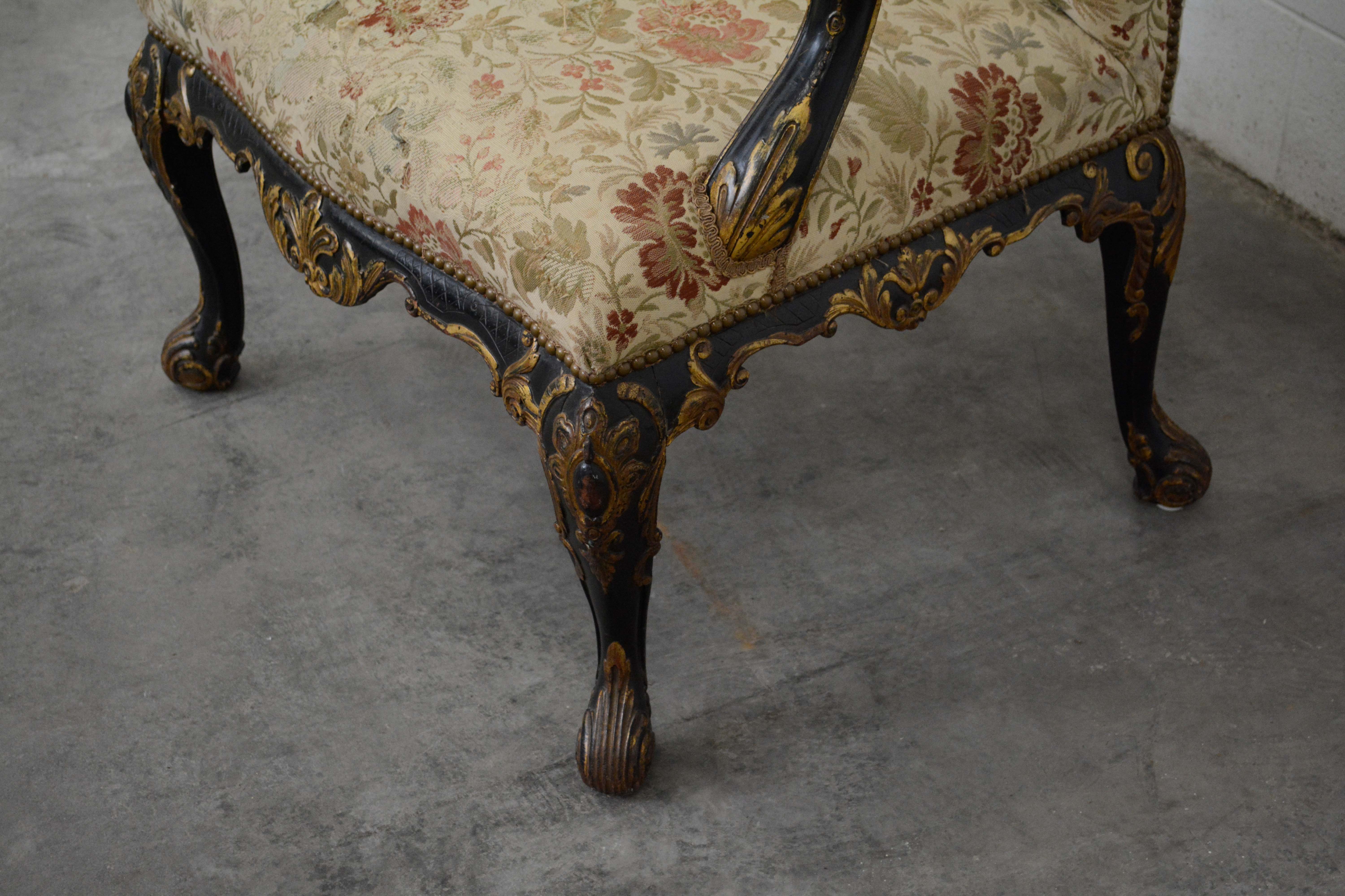 George II Style Ebonized and Parcel-Gilt Wingback Armchair, 20th Century