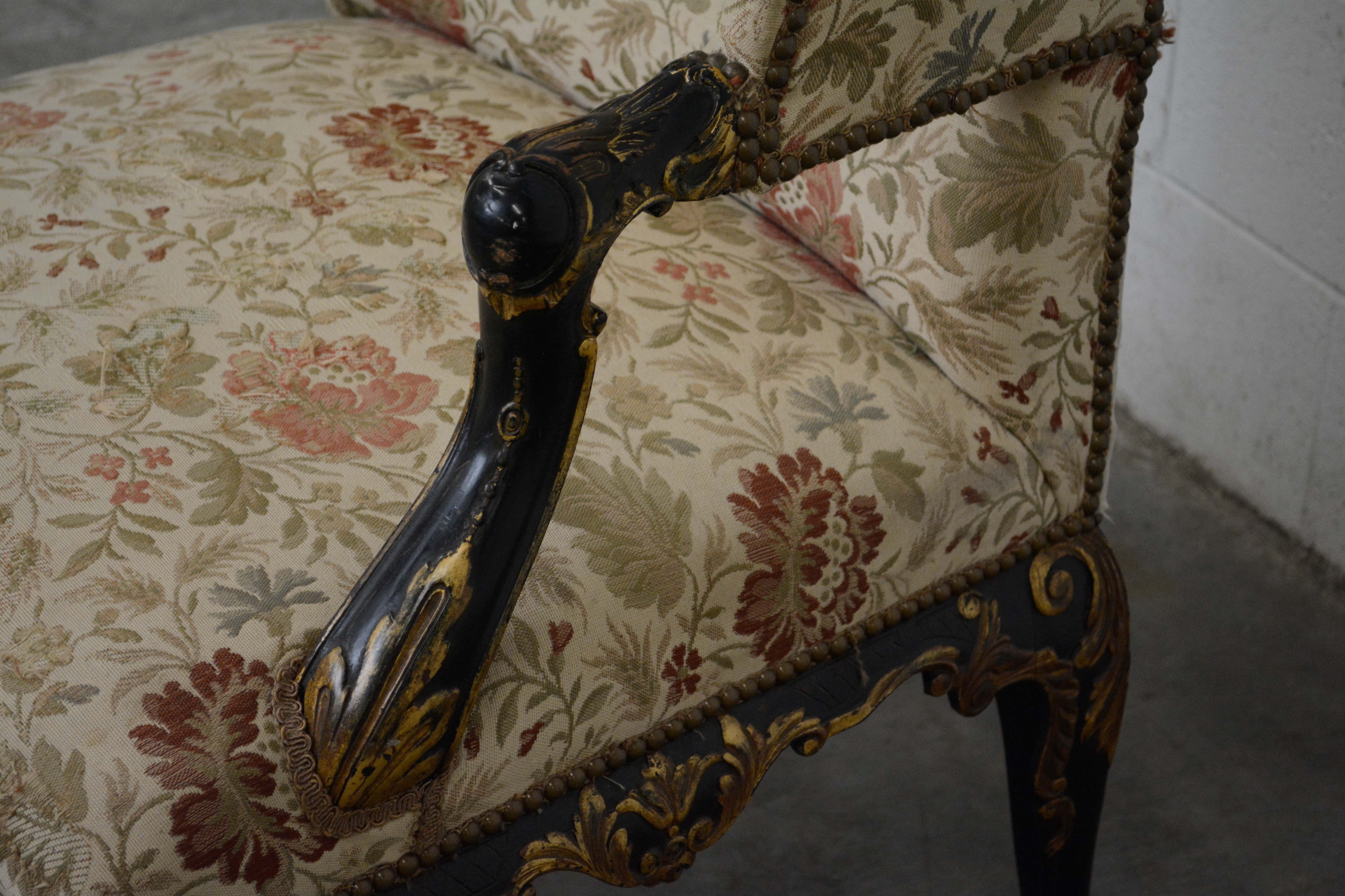 George II Style Ebonized and Parcel-Gilt Wingback Armchair, 20th Century