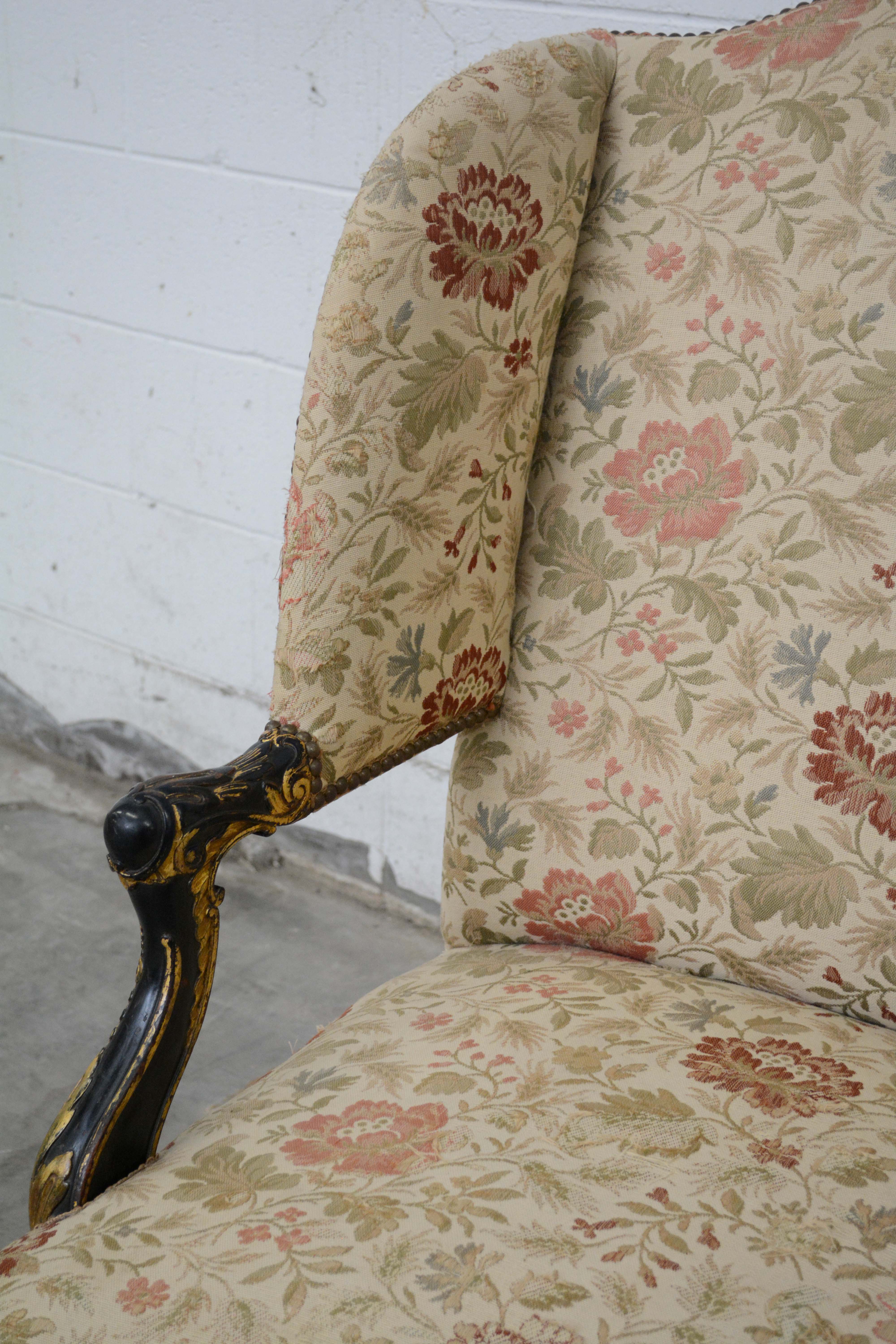 George II Style Ebonized and Parcel-Gilt Wingback Armchair, 20th Century