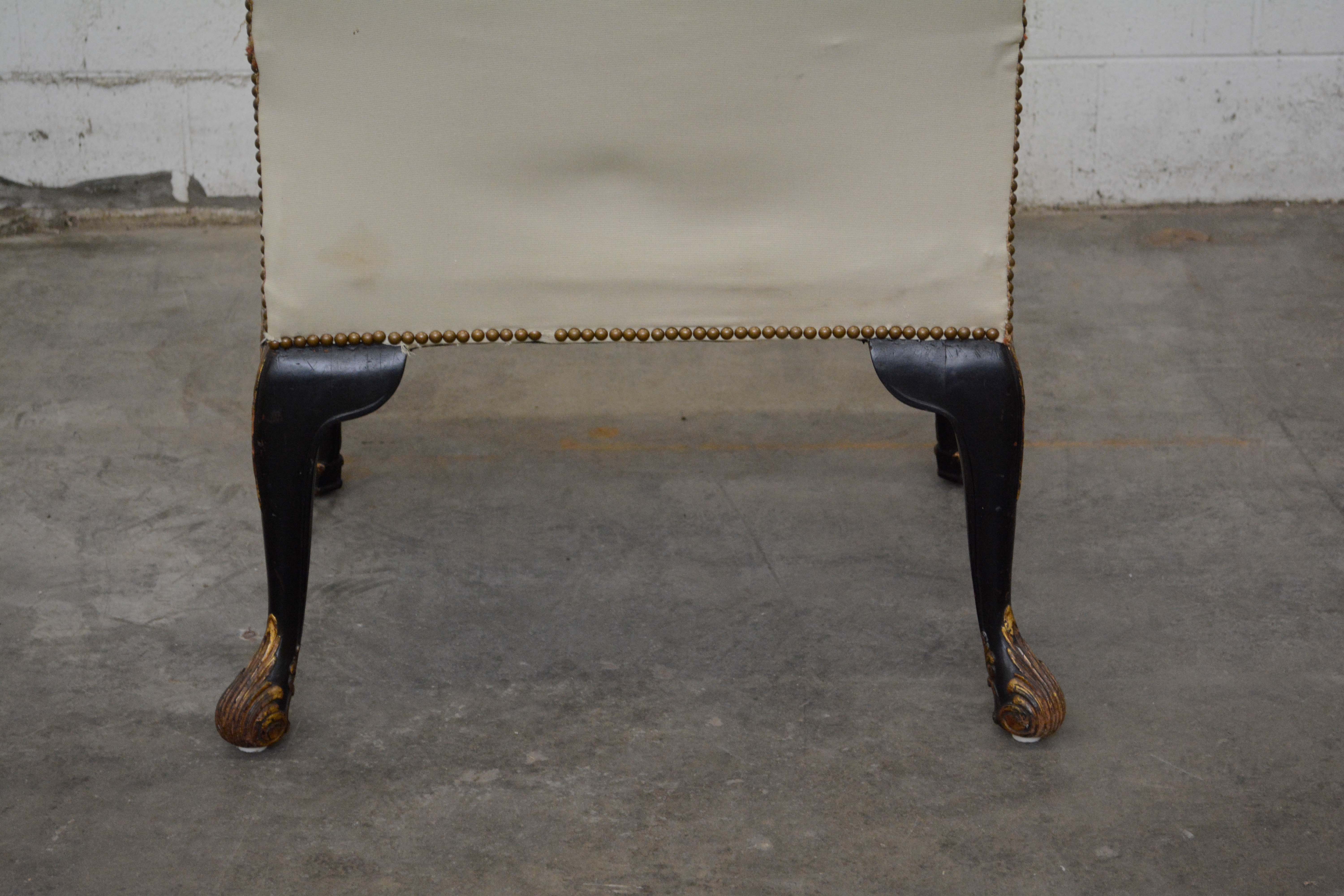 George II Style Ebonized and Parcel-Gilt Wingback Armchair, 20th Century