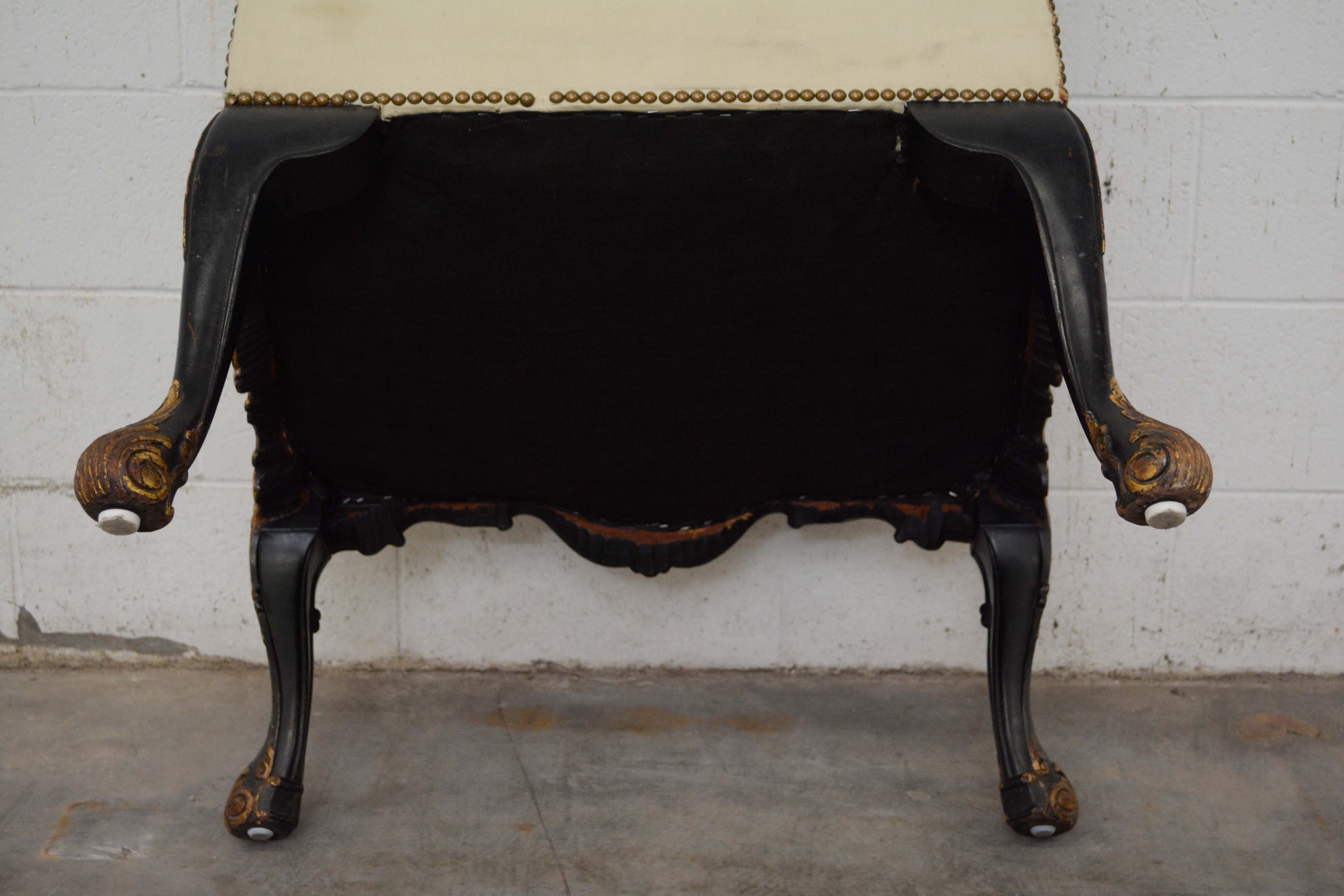 George II Style Ebonized and Parcel-Gilt Wingback Armchair, 20th Century