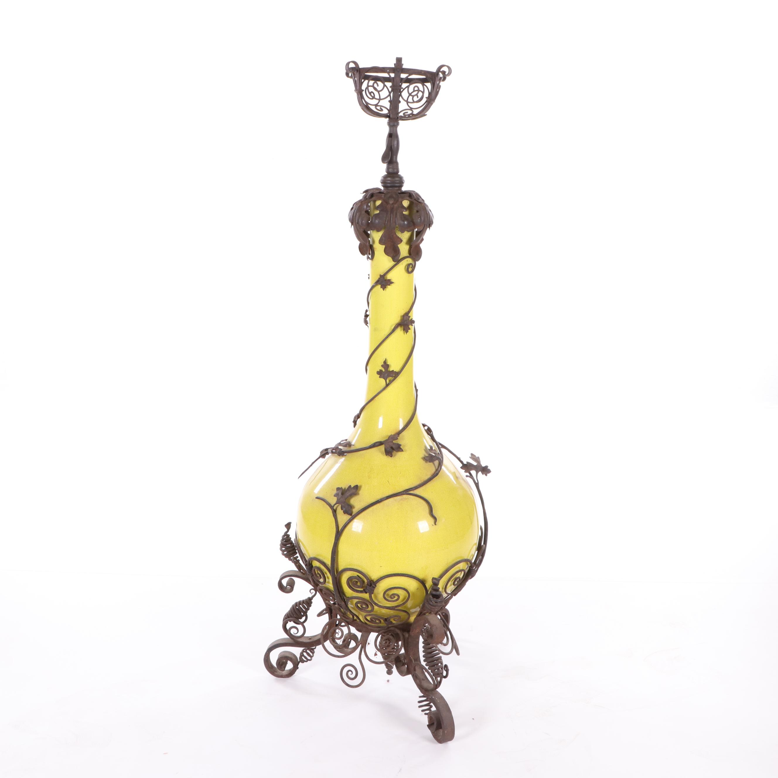 Oversized Yellow Glazed Vase Mounted in Scrolled Wrought Iron Work