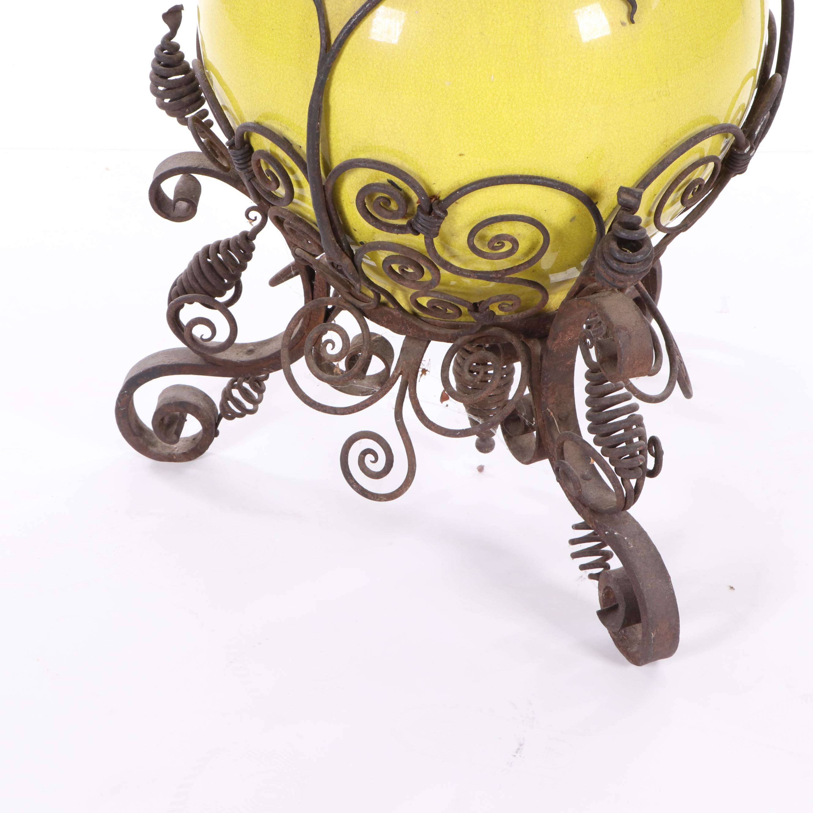Oversized Yellow Glazed Vase Mounted in Scrolled Wrought Iron Work