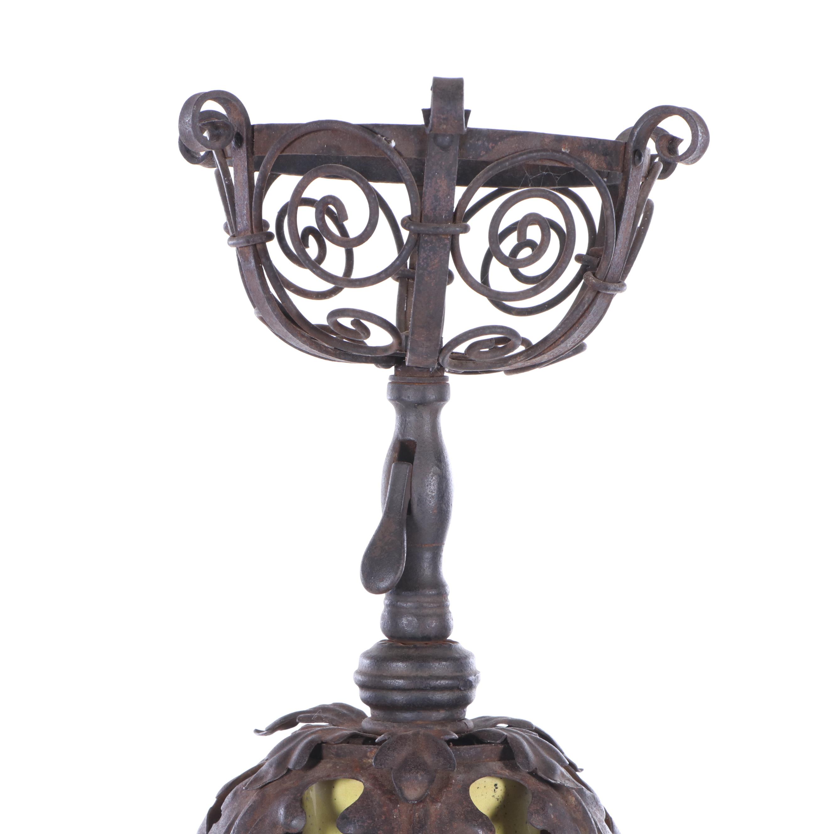 Oversized Yellow Glazed Vase Mounted in Scrolled Wrought Iron Work