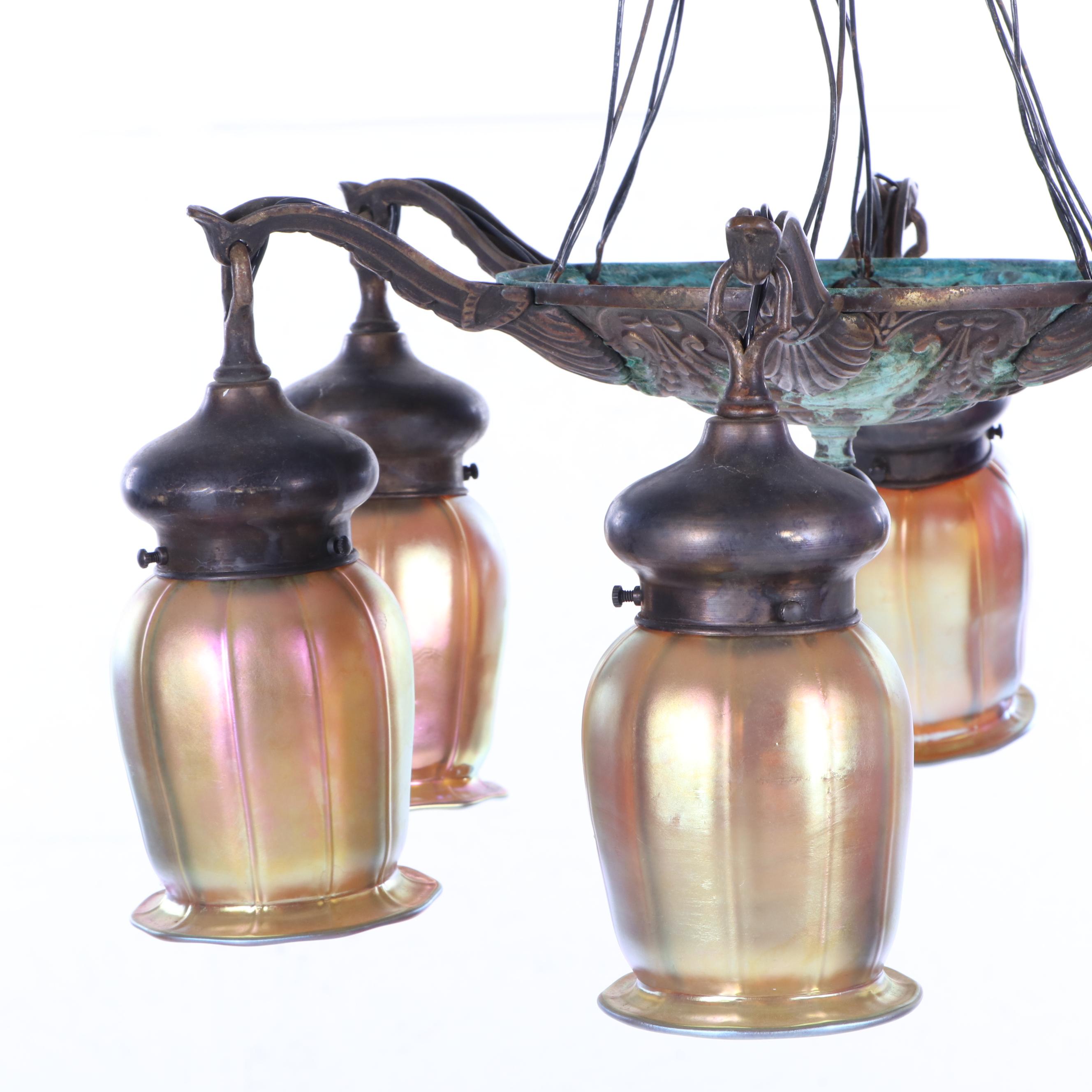 Iridescent Glass Shades Attributed to Quezal together with a Bronze Chandelier