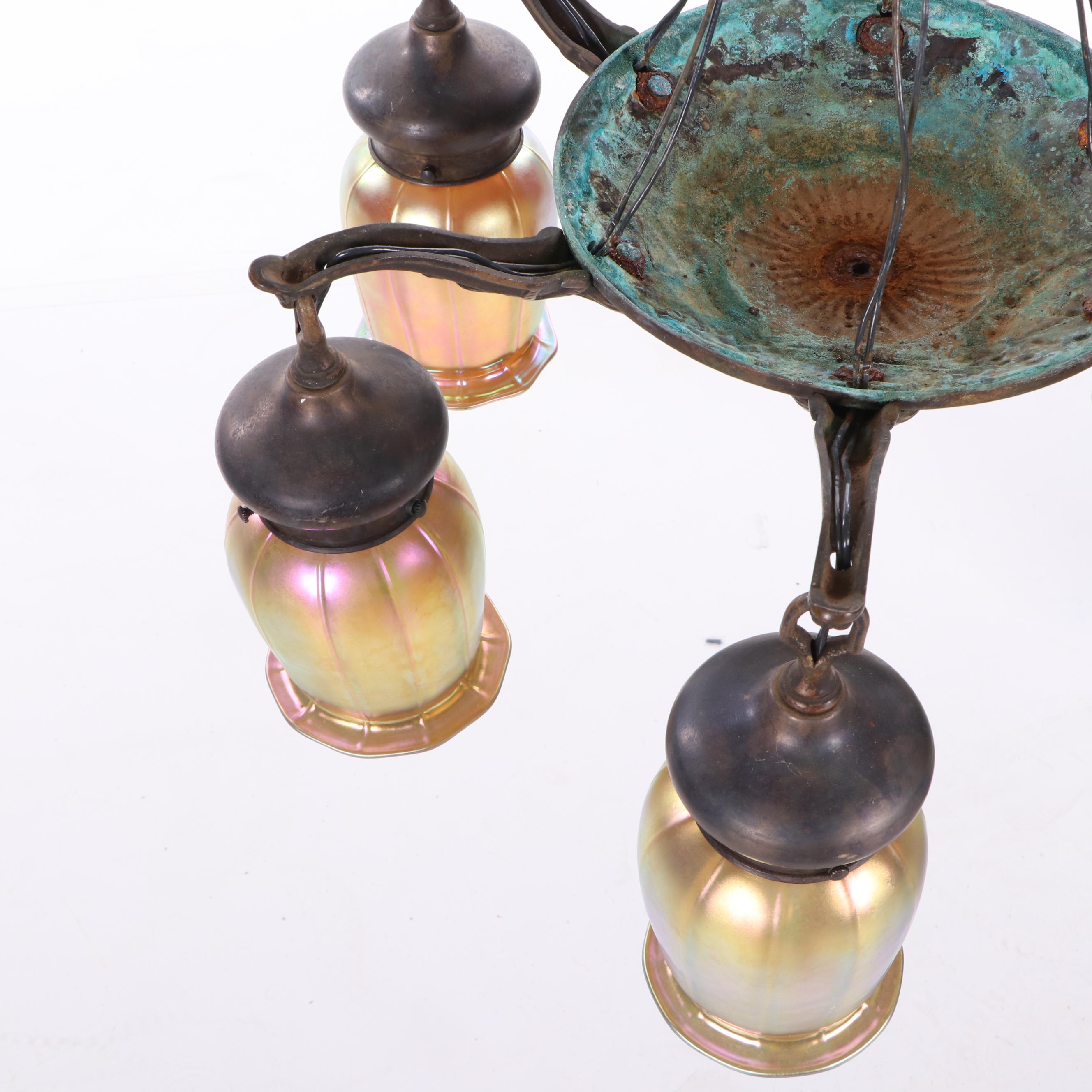 Iridescent Glass Shades Attributed to Quezal together with a Bronze Chandelier