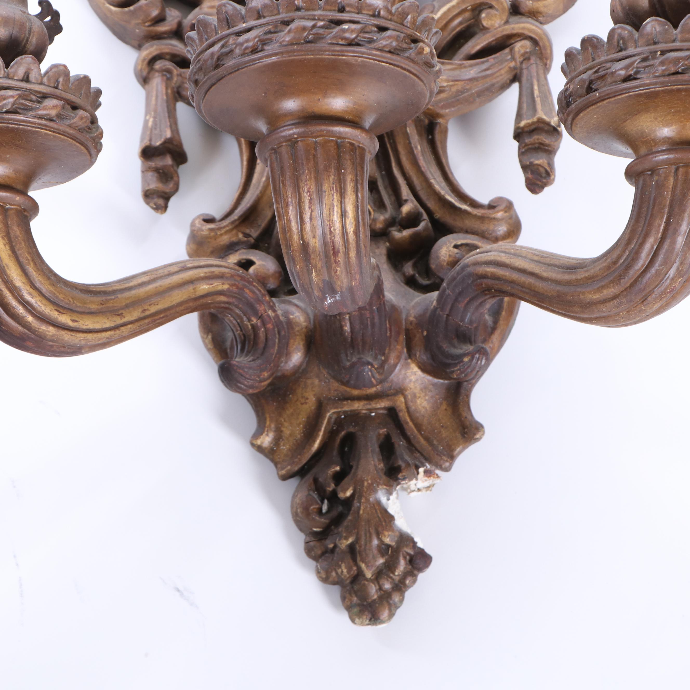 Antique Three-Arm Putti Figural Composite and Metal Wall Sconces