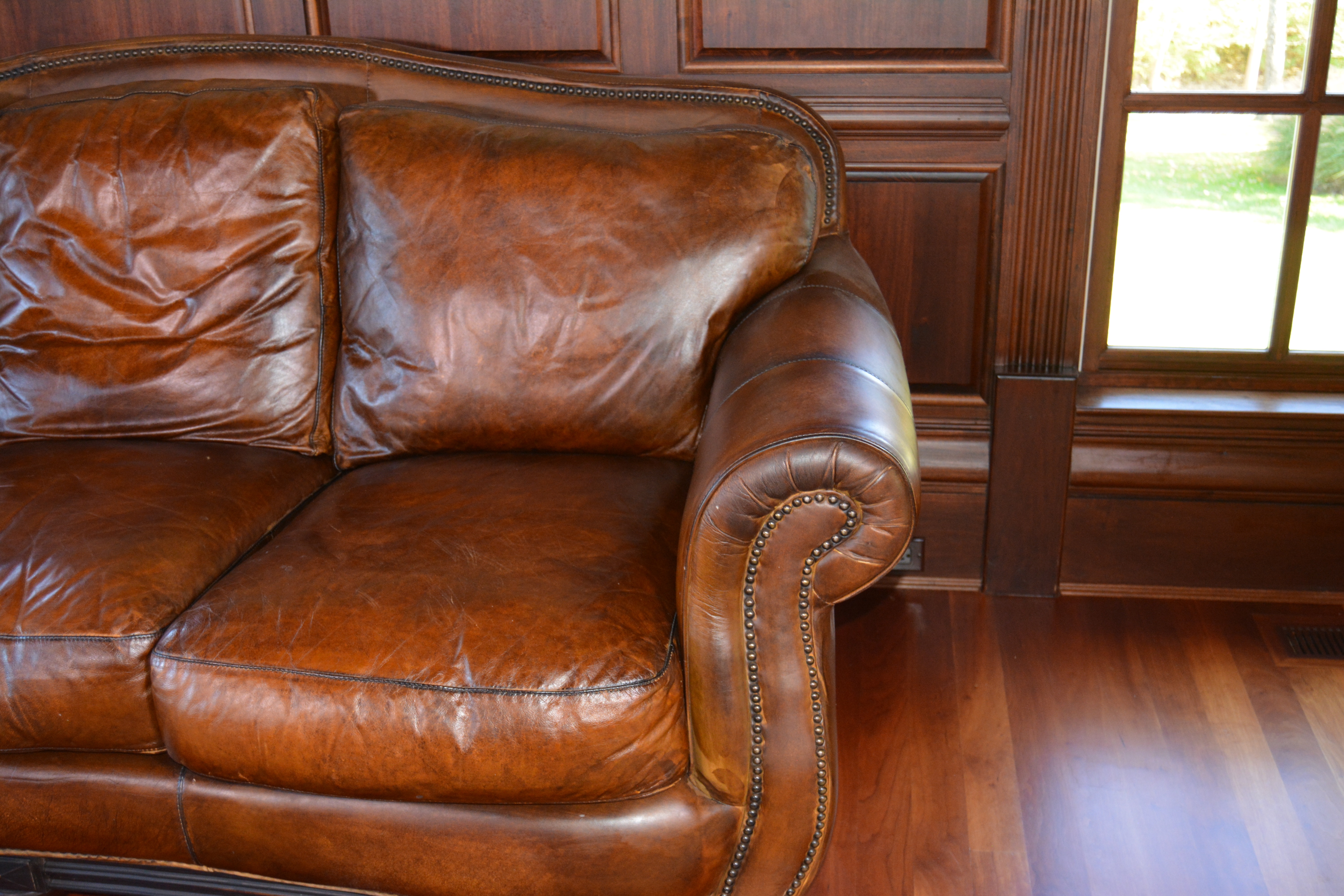 Contemporary Camelback Leather Sofa by Haverty's