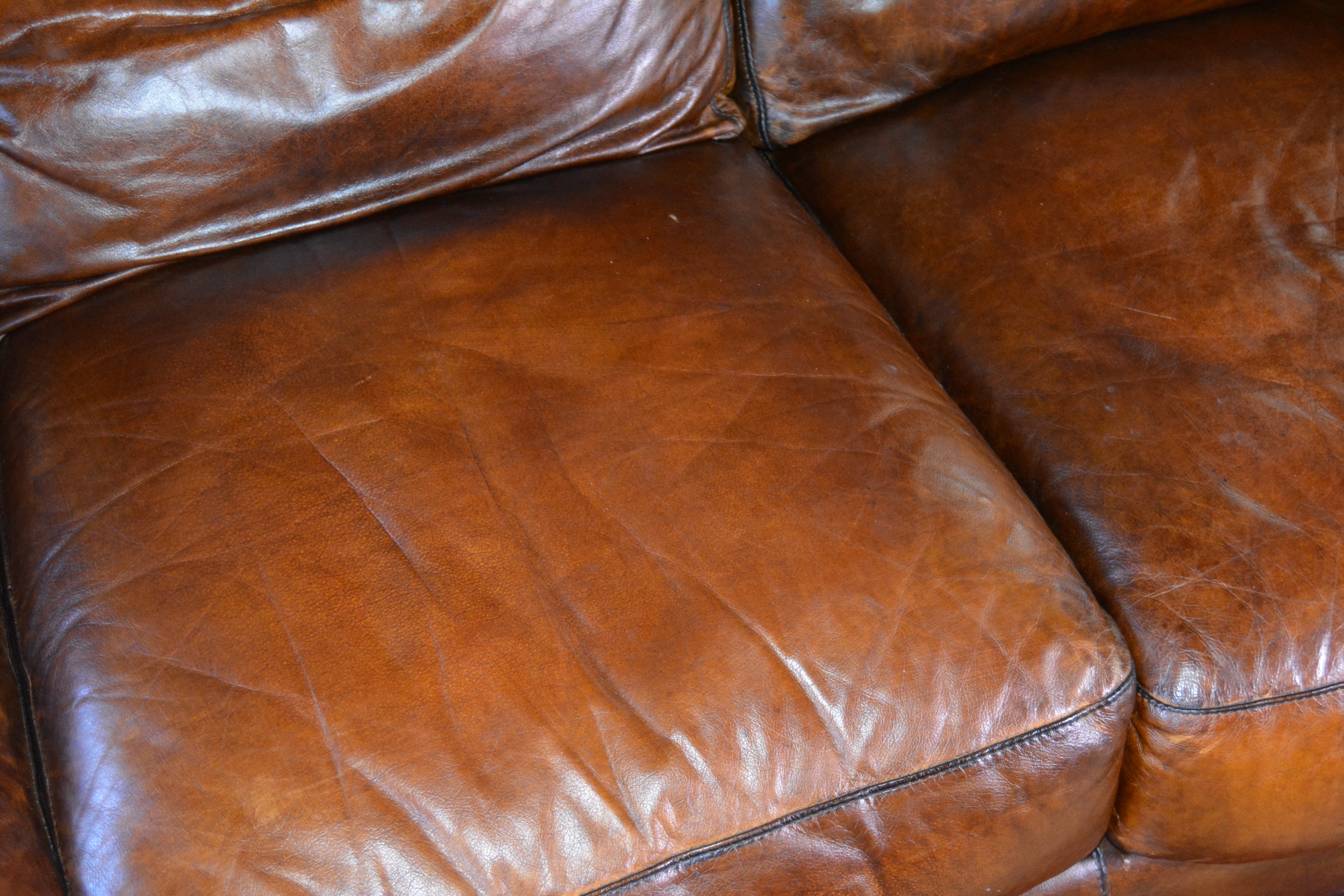 Contemporary Camelback Leather Sofa by Haverty's