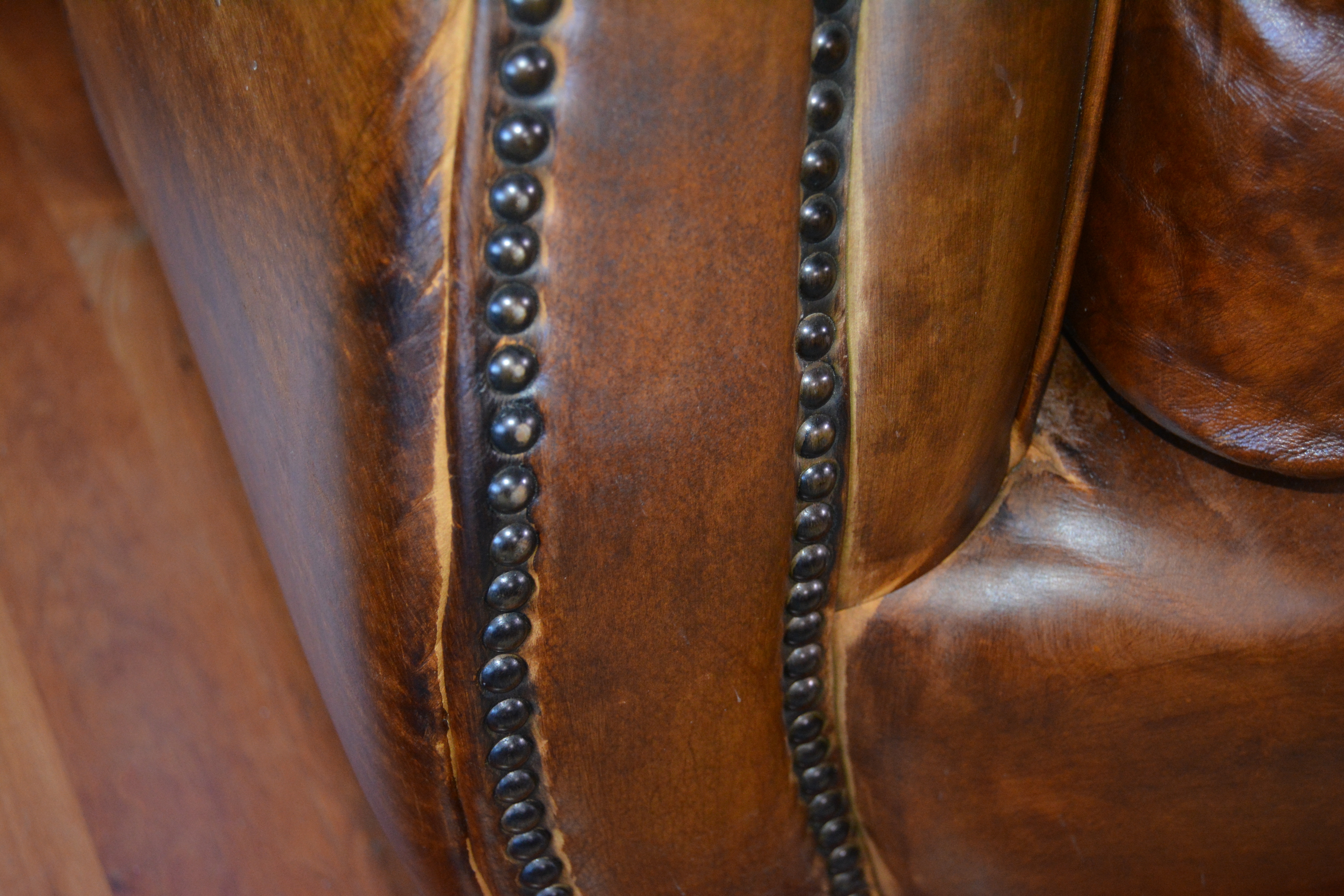 Contemporary Camelback Leather Sofa by Haverty's