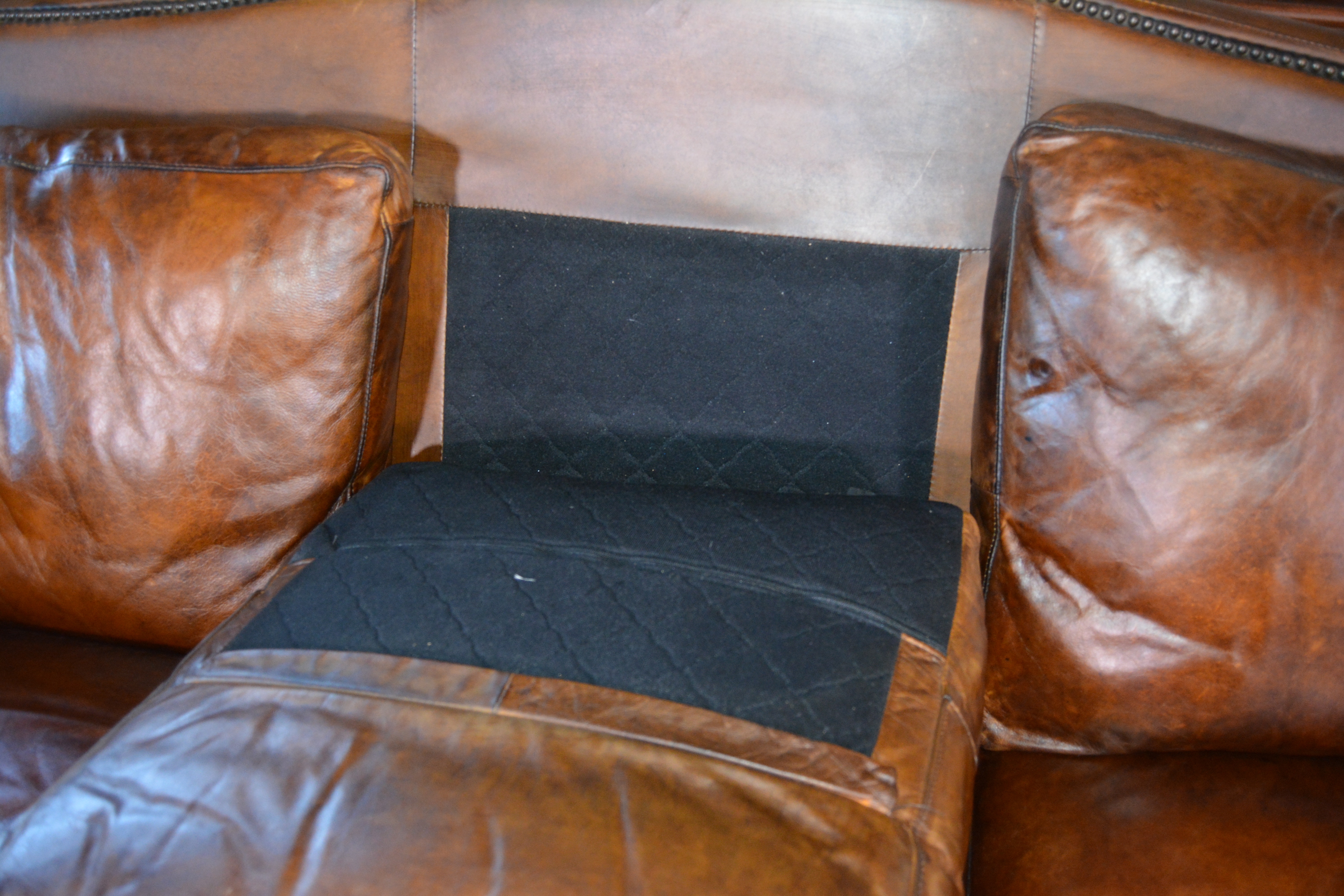 Contemporary Camelback Leather Sofa by Haverty's