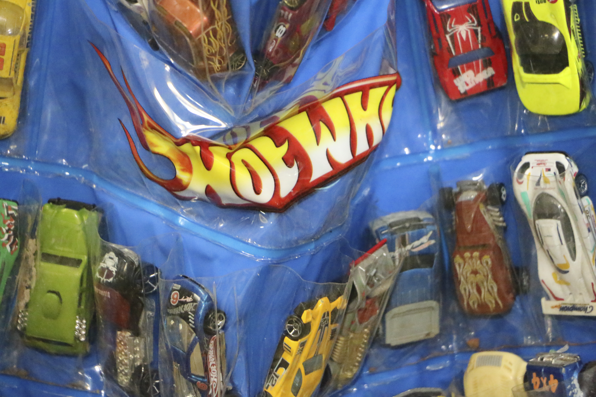 Miniature Die-Cast Cars in Hot Wheels Hanging Case
