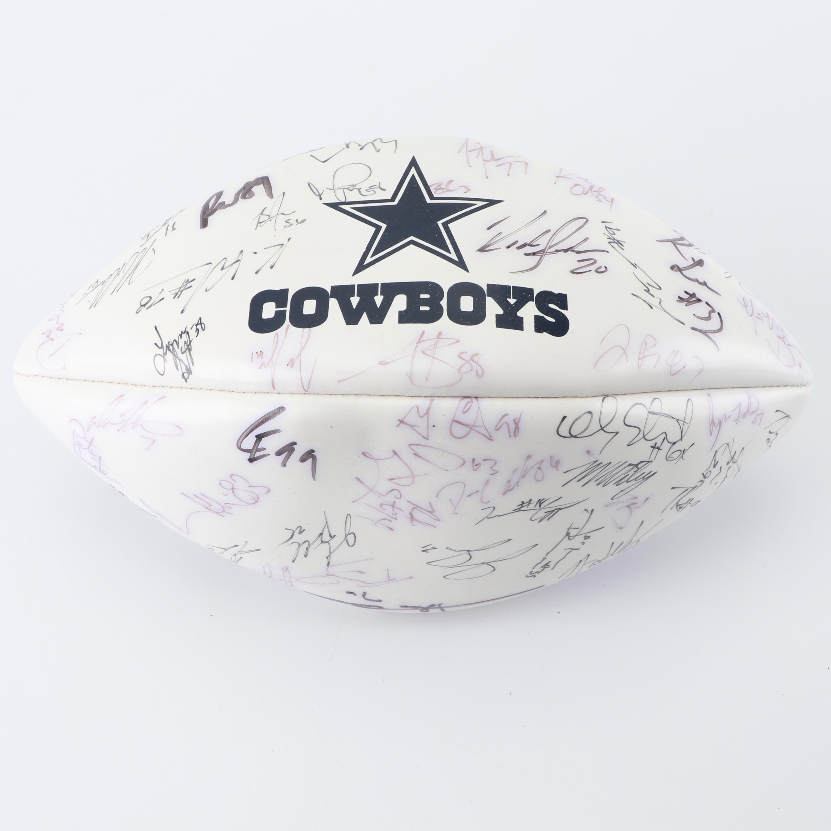 Dallas Cowboys Football Autographed by Tony Romo, Paul Taglaibue and Others
