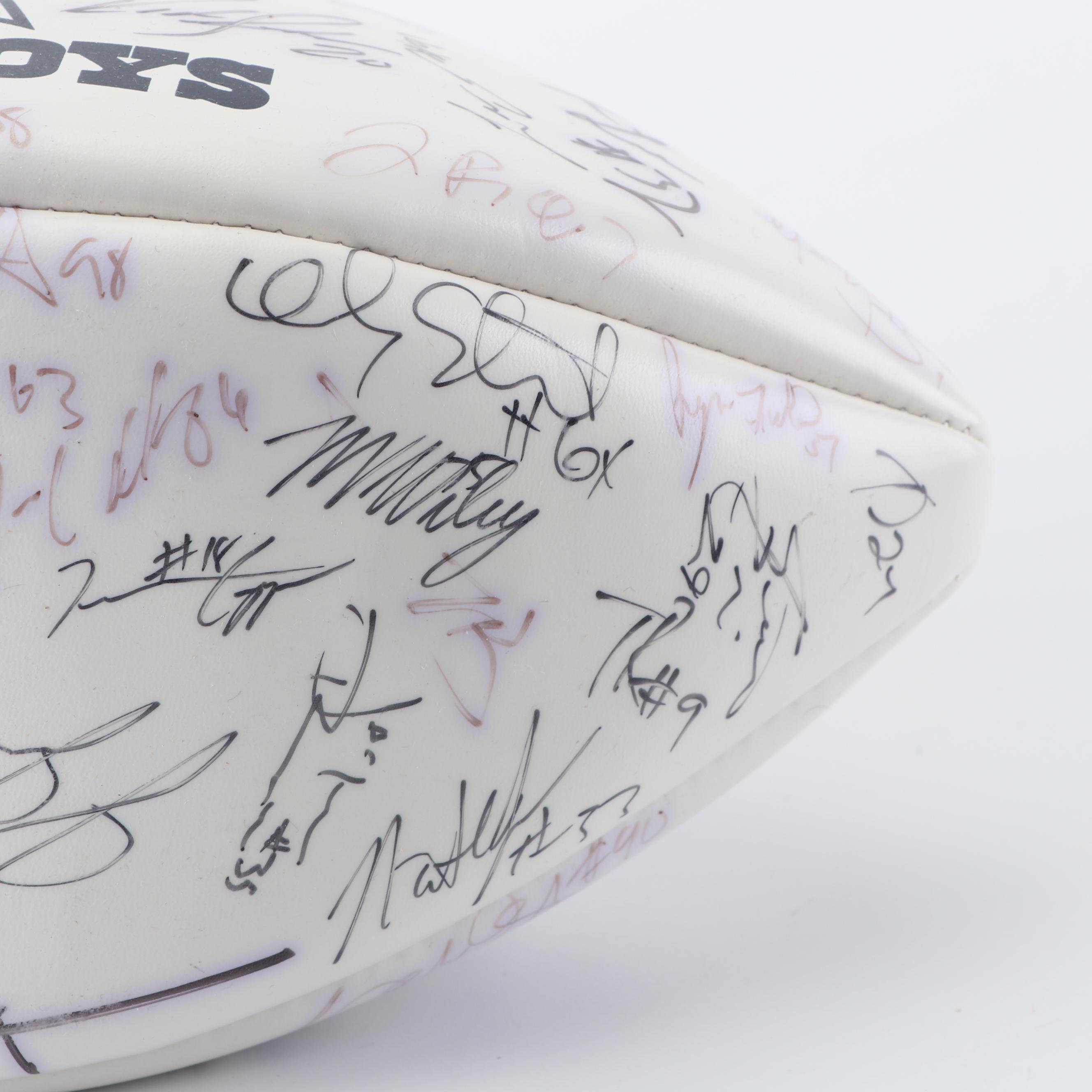 Dallas Cowboys Football Autographed by Tony Romo, Paul Taglaibue and Others