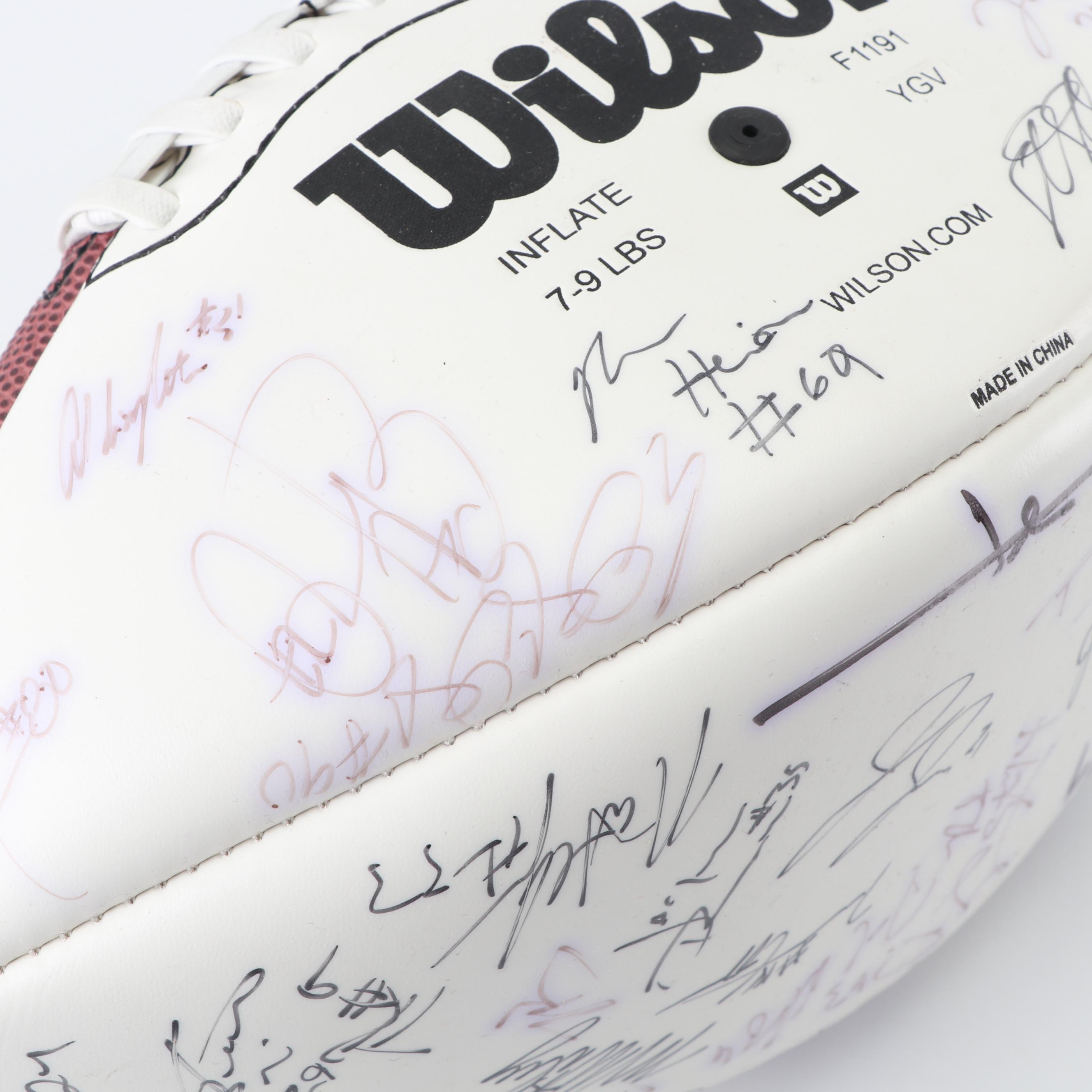 Dallas Cowboys Football Autographed by Tony Romo, Paul Taglaibue and Others