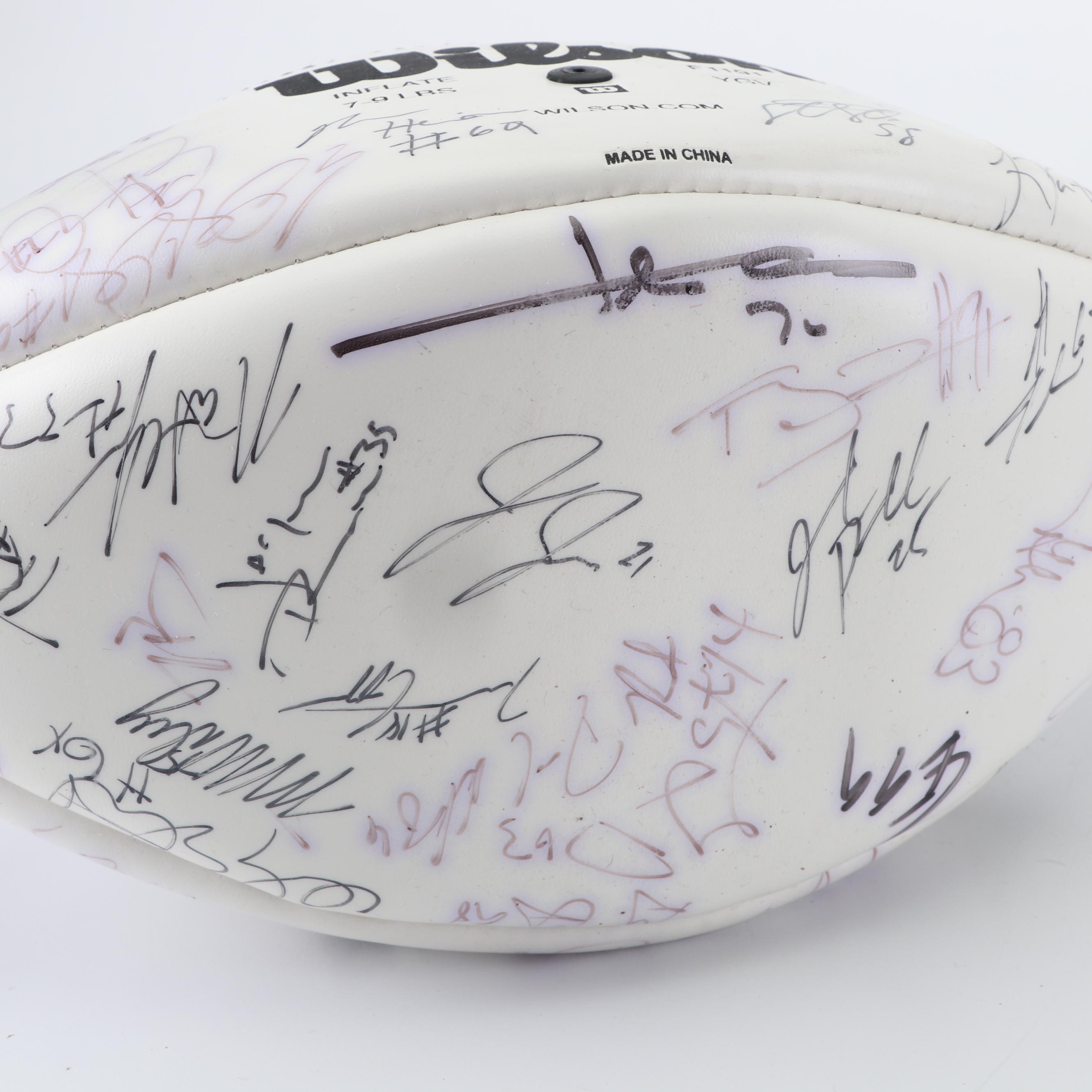 Dallas Cowboys Football Autographed by Tony Romo, Paul Taglaibue and Others