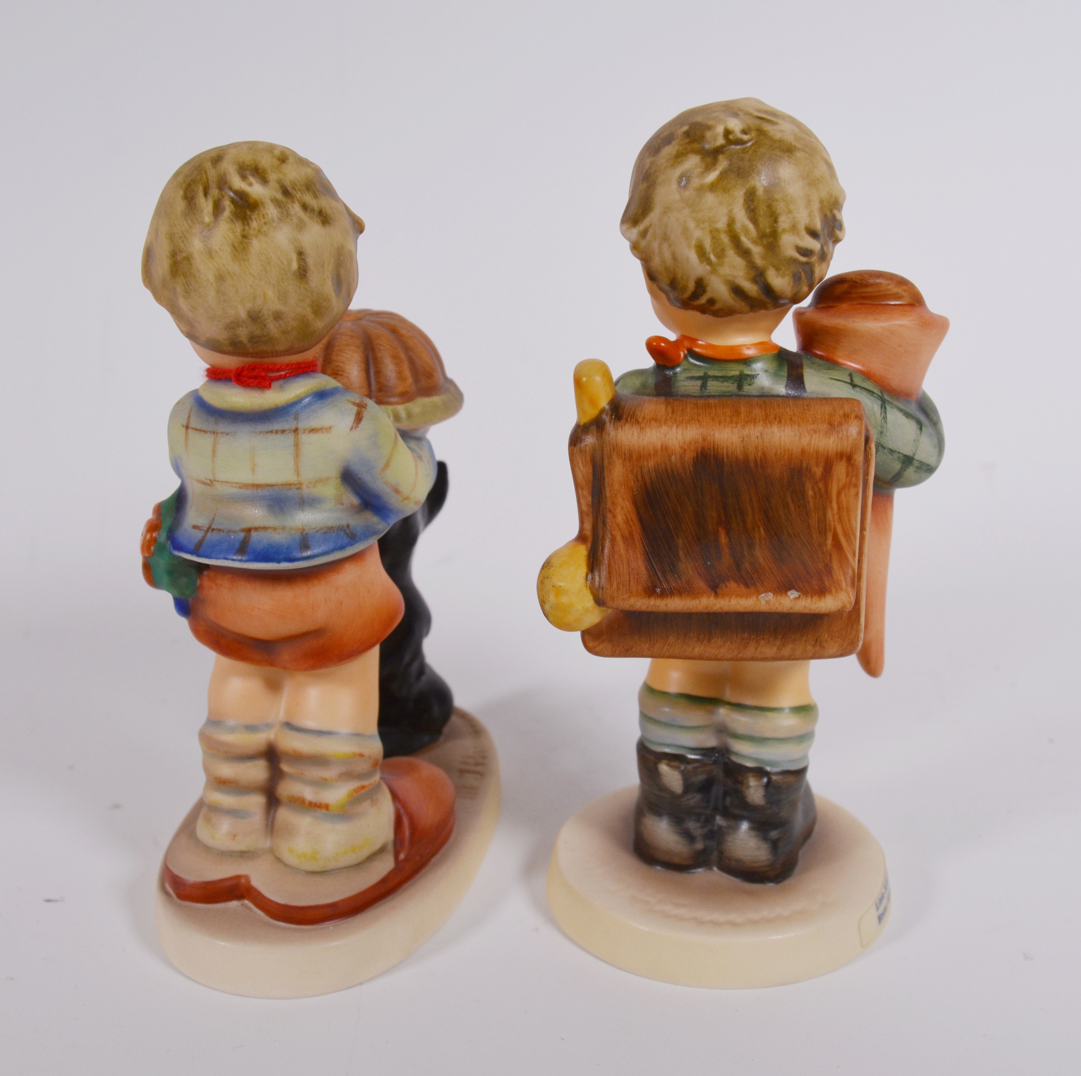Goebel M.I. Hummel "Little Scholar" and "Begging His Share" Porcelain Figurines