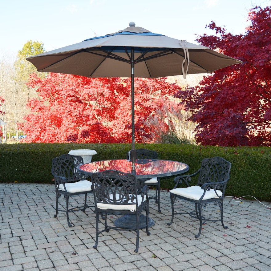 Cast Iron Patio Table, Chairs, and Umbrella