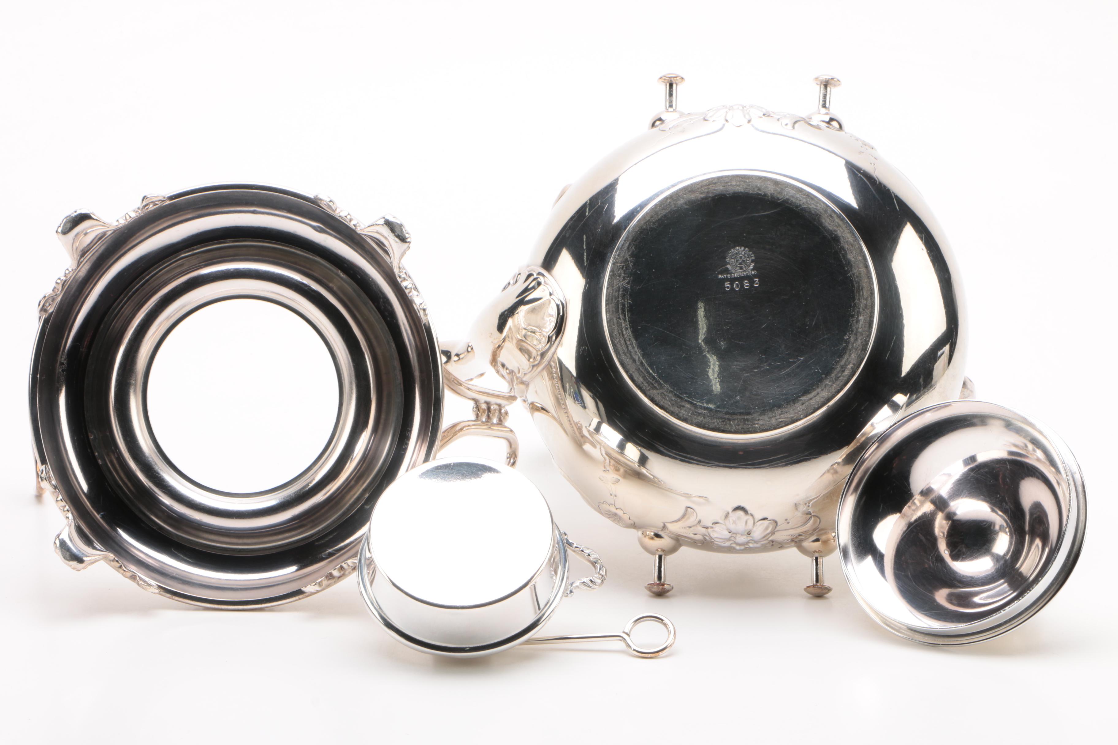 Wilcox Silver Plate Co. Repoussé Teapot with Warming Tilt Stand