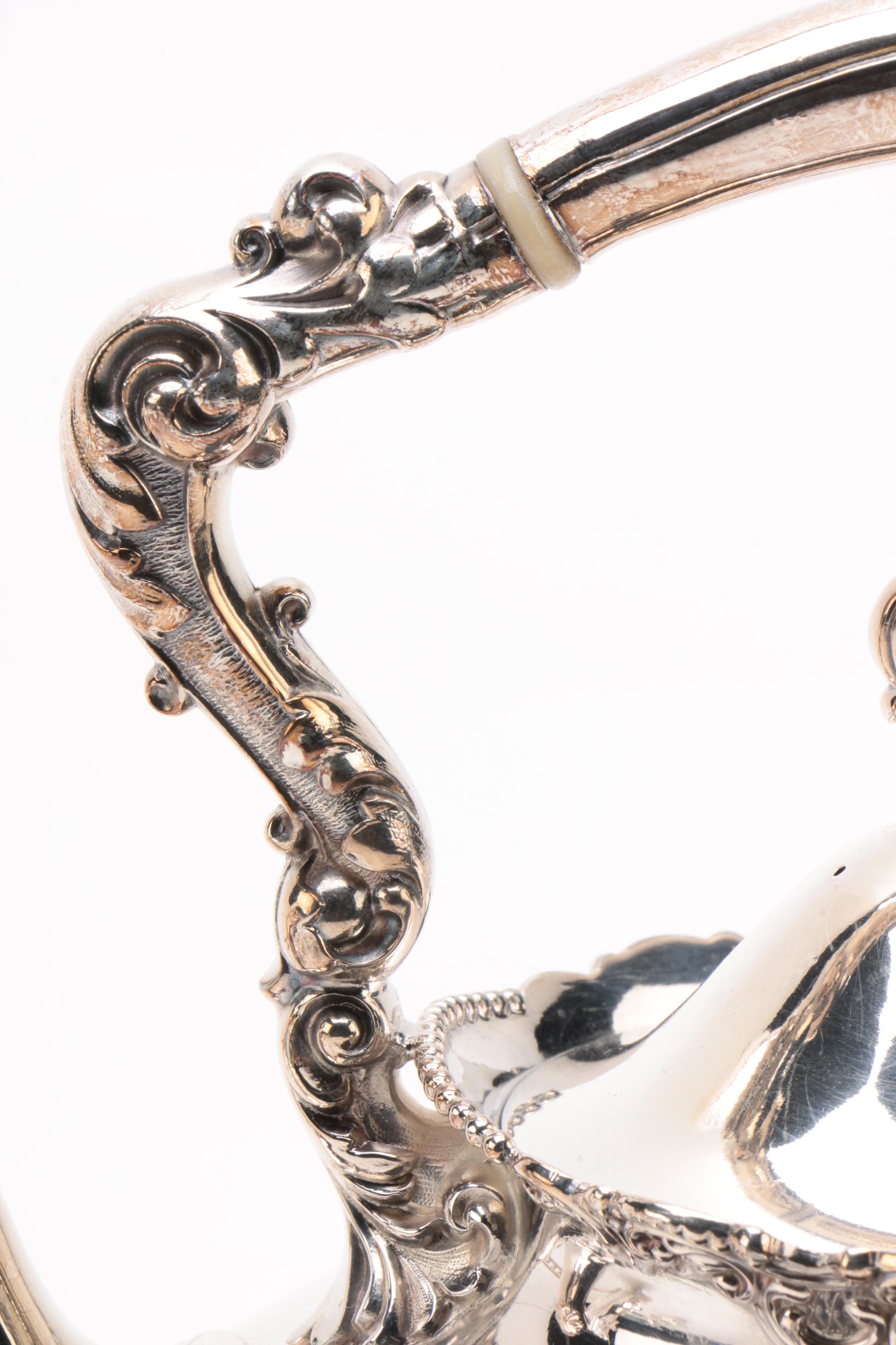 Wilcox Silver Plate Co. Repoussé Teapot with Warming Tilt Stand