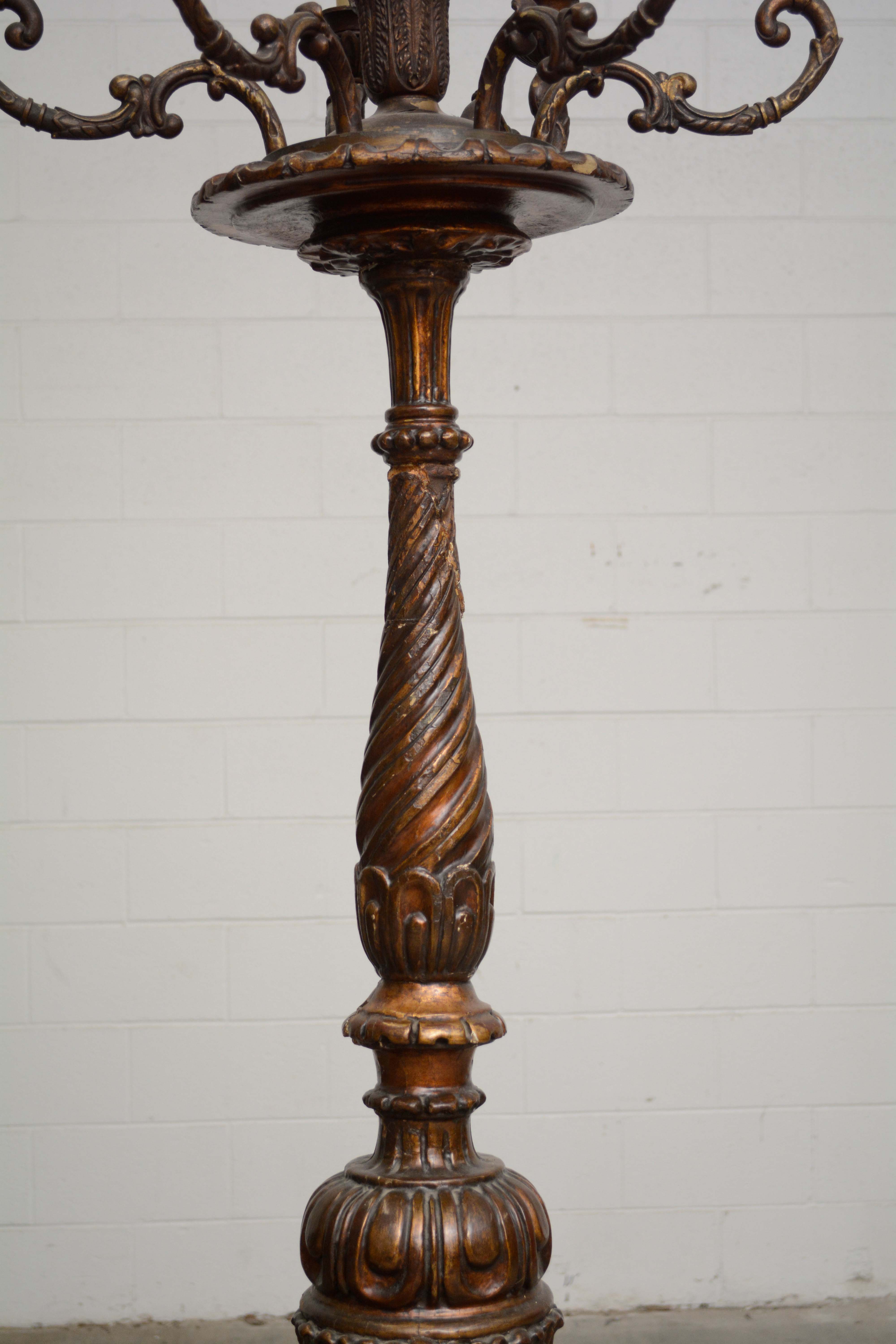 Ornately Carved Wooden Light Standards Featuring Heraldic Panels and Paw Feet