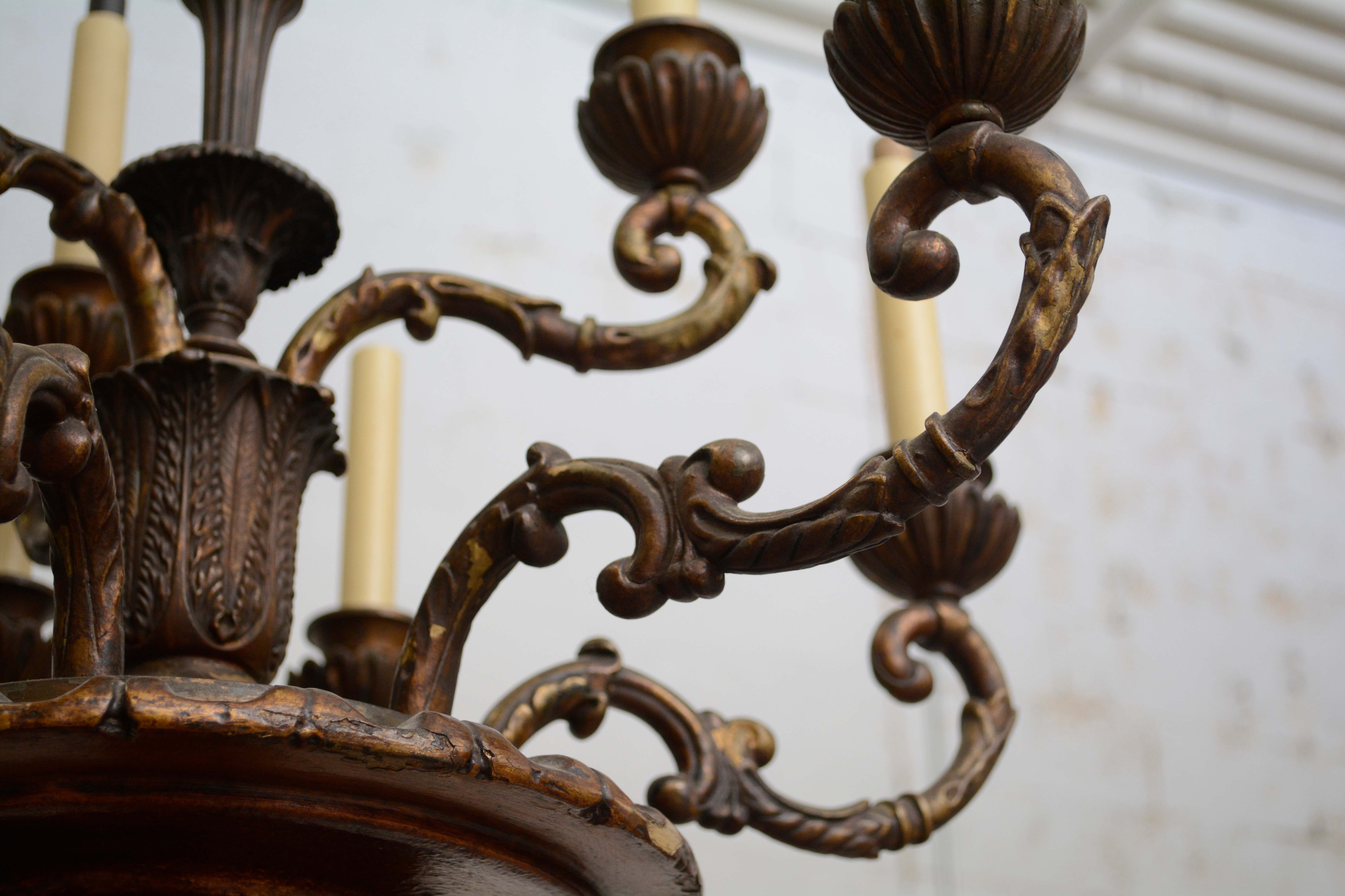 Ornately Carved Wooden Light Standards Featuring Heraldic Panels and Paw Feet