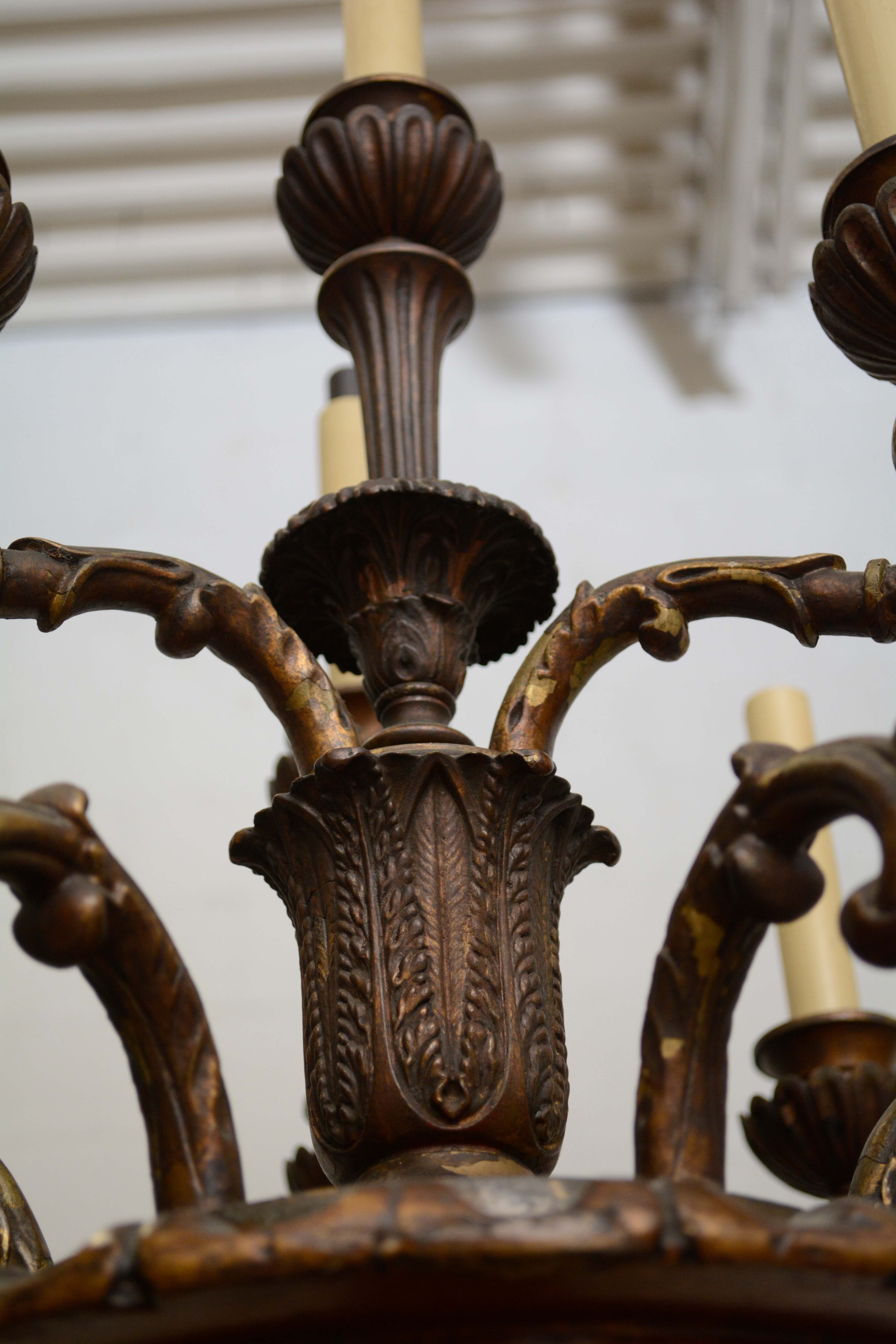 Ornately Carved Wooden Light Standards Featuring Heraldic Panels and Paw Feet