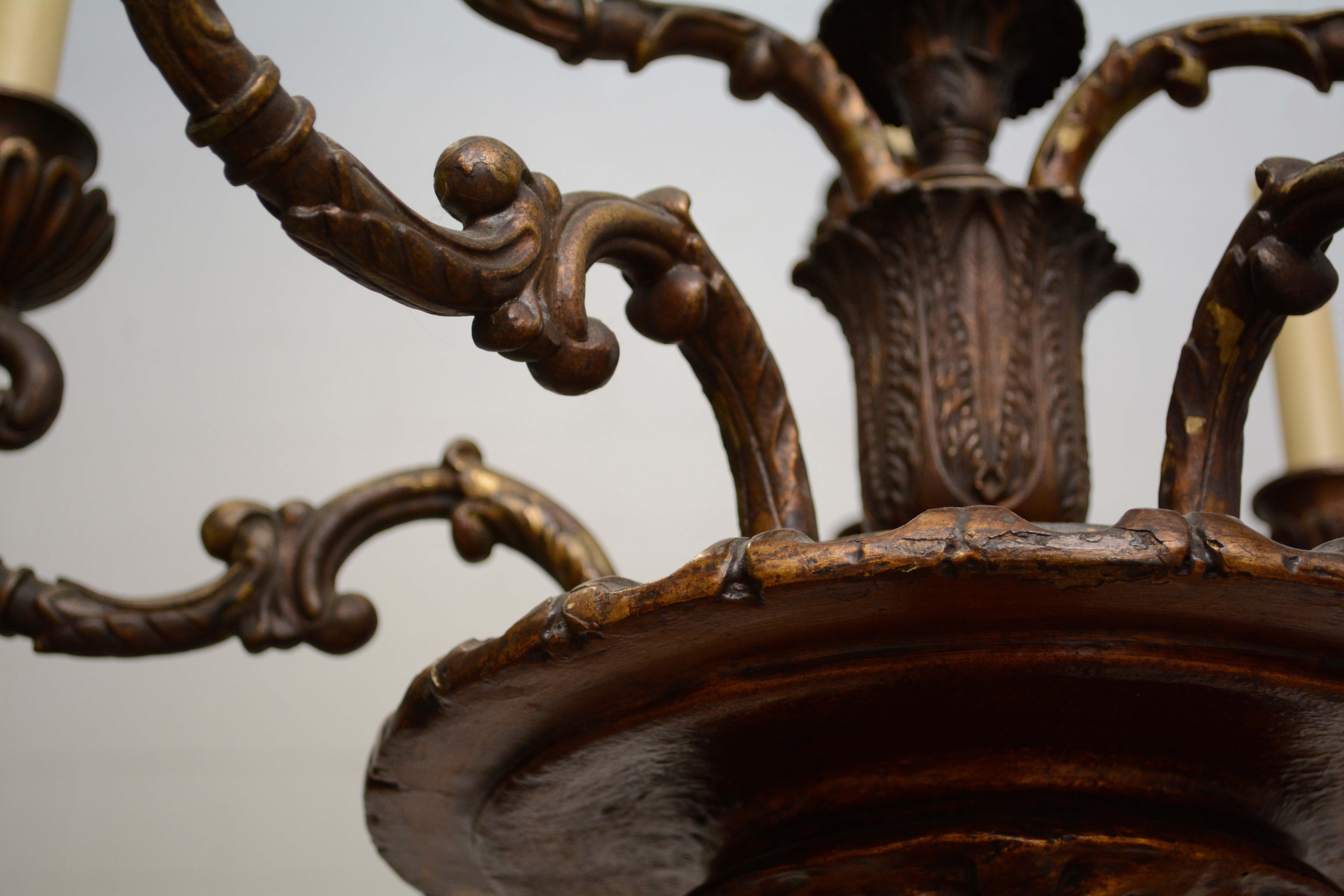 Ornately Carved Wooden Light Standards Featuring Heraldic Panels and Paw Feet
