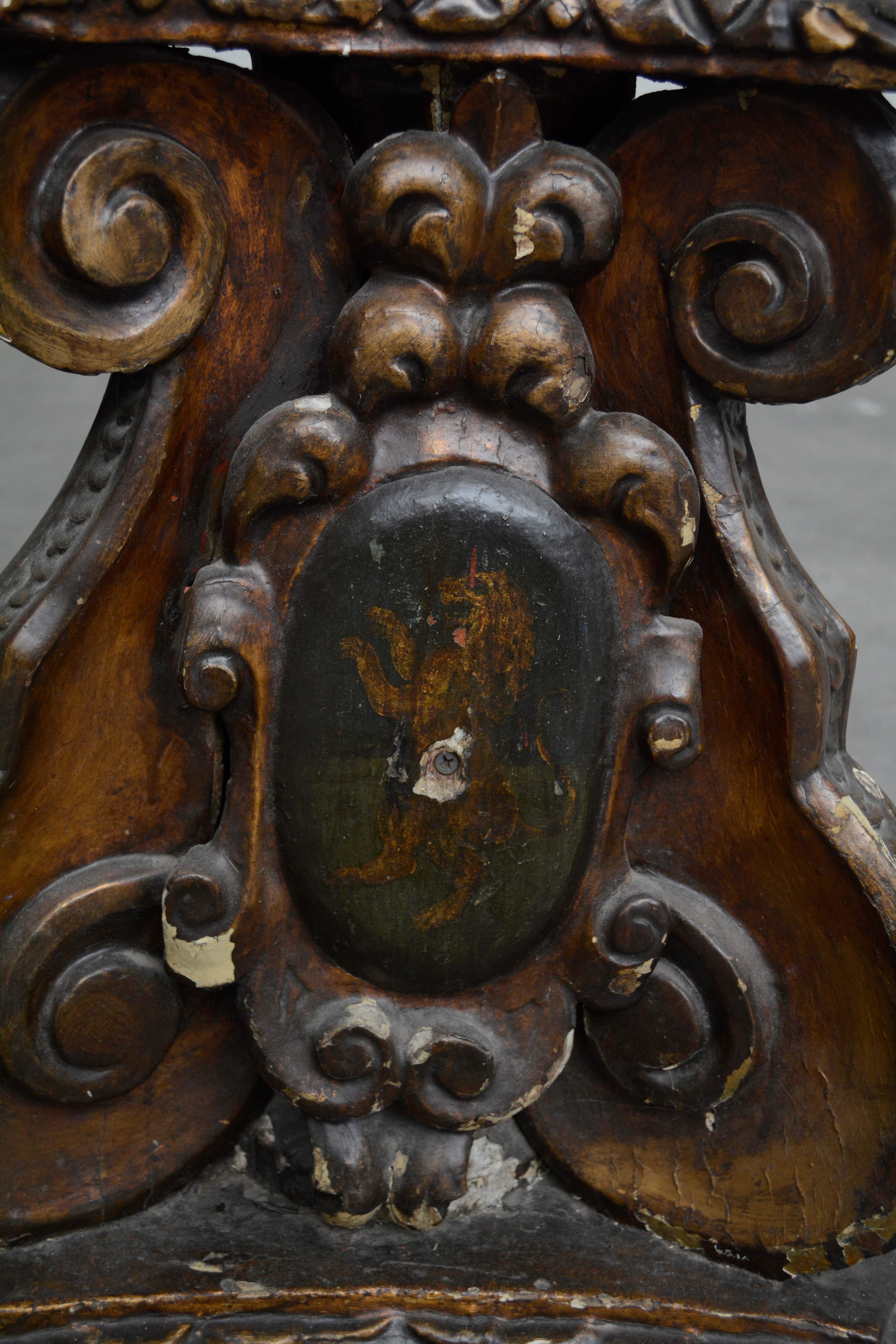 Ornately Carved Wooden Light Standards Featuring Heraldic Panels and Paw Feet