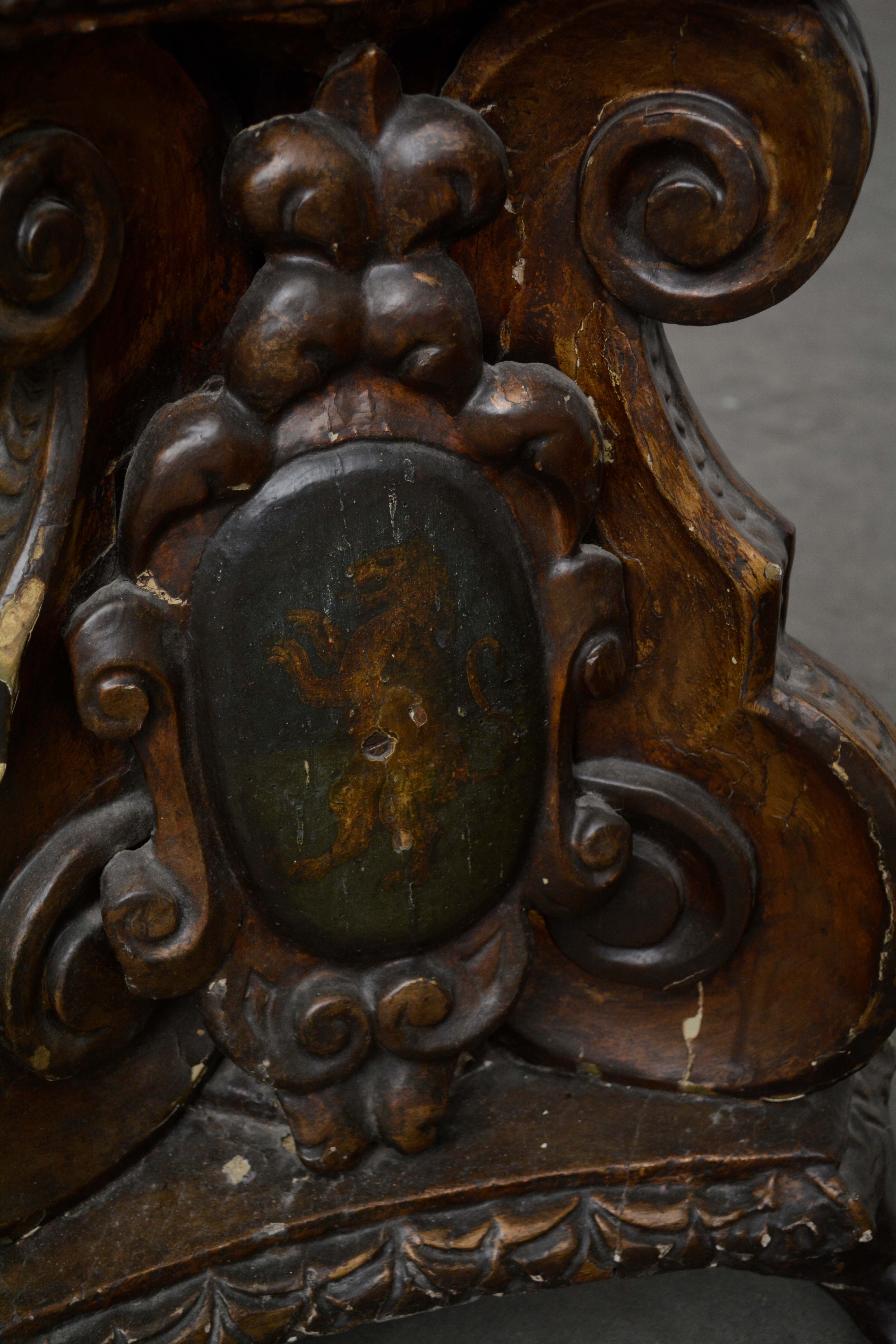 Ornately Carved Wooden Light Standards Featuring Heraldic Panels and Paw Feet