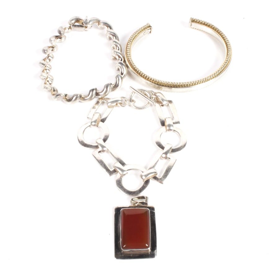 Sterling Silver and Carnelian Pendant and Three Sterling Silver Bracelets