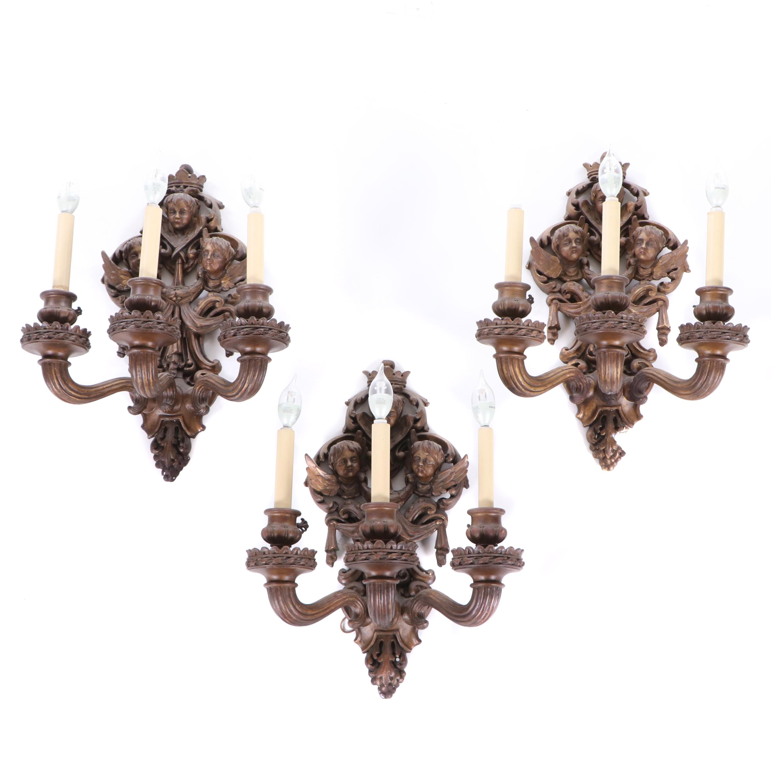 Antique Three-Arm Putti Figural Composite and Metal Wall Sconces