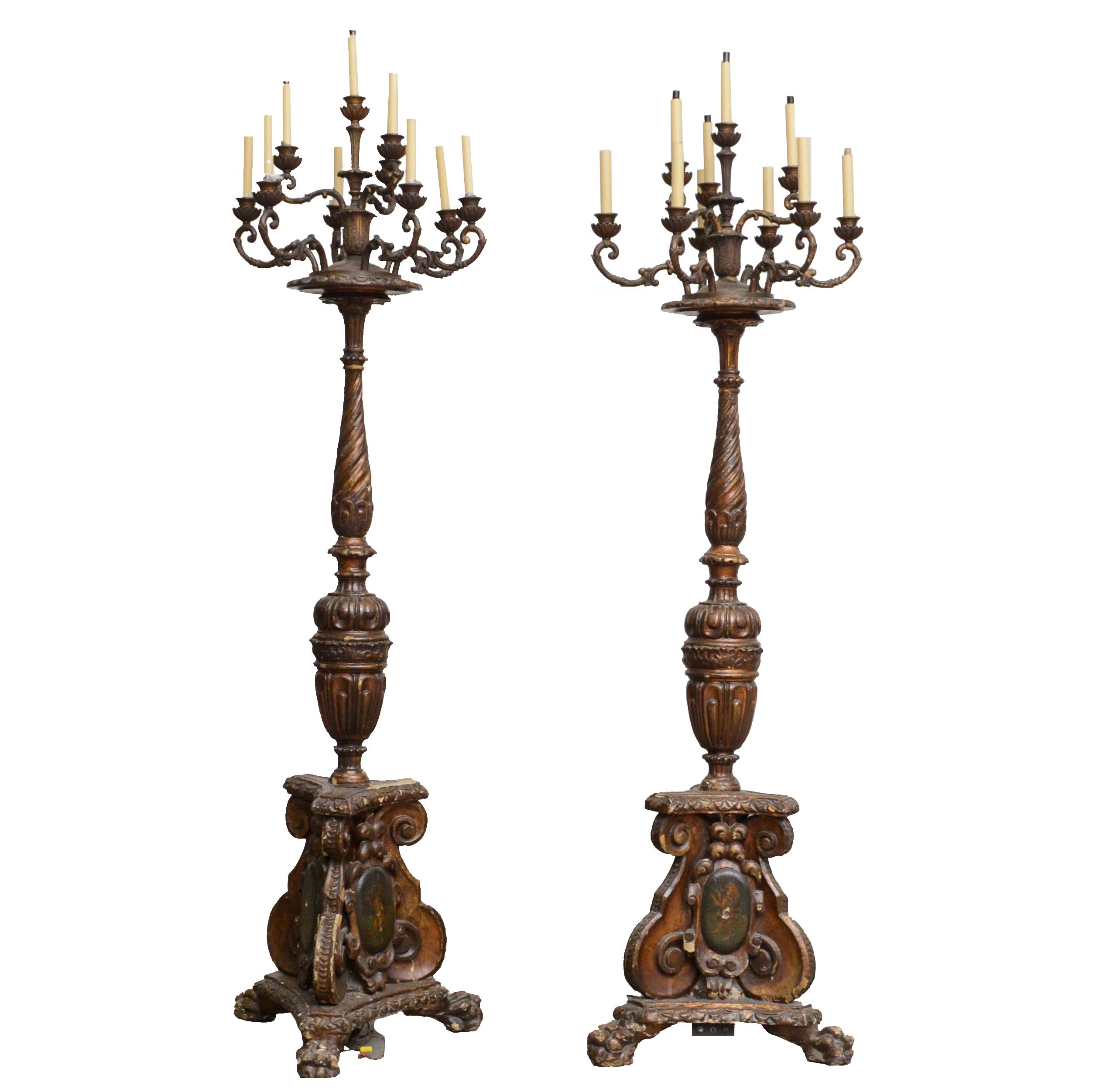 Ornately Carved Wooden Light Standards Featuring Heraldic Panels and Paw Feet