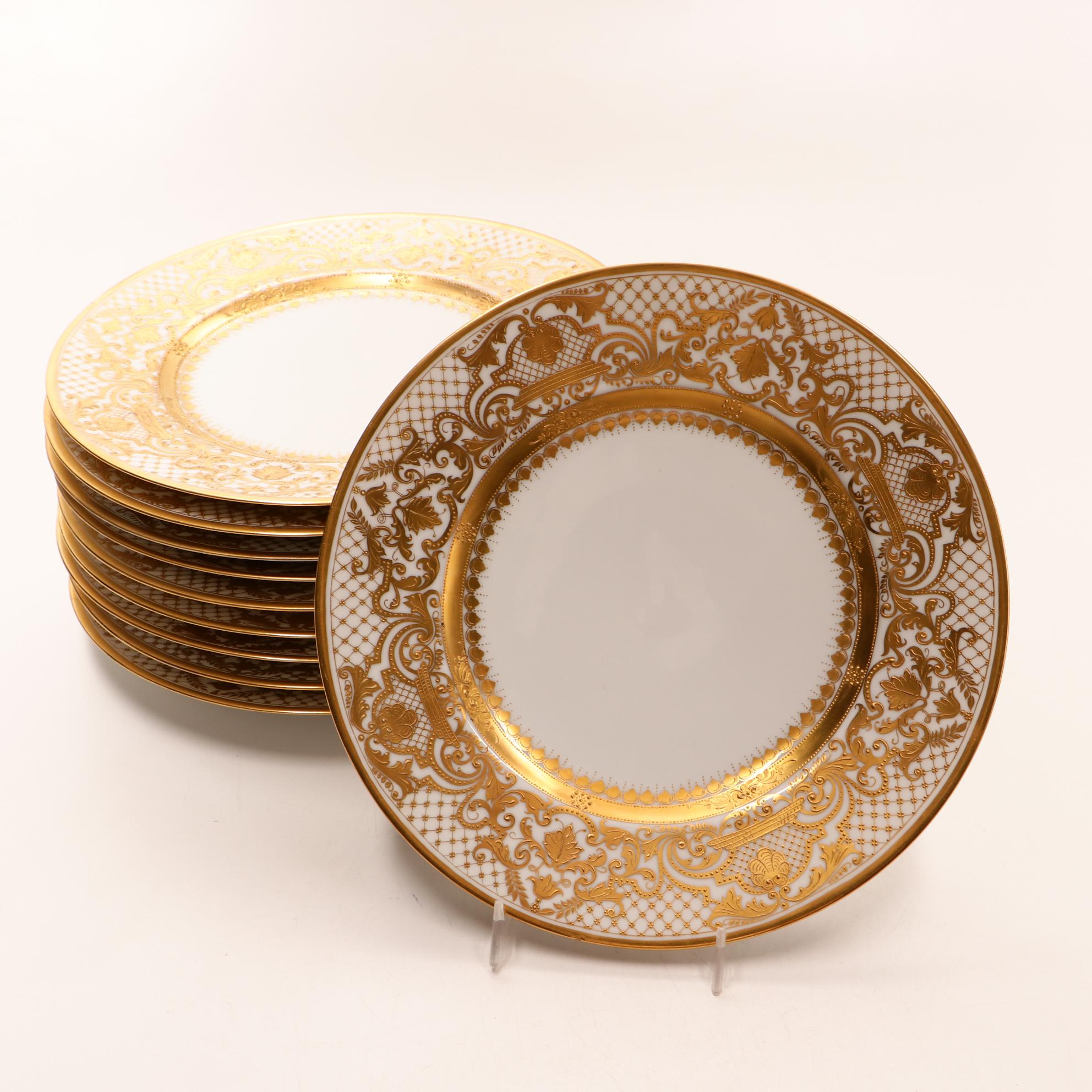 Assorted Gold and White Dinnerware Featuring Limoges and Royal Worcester