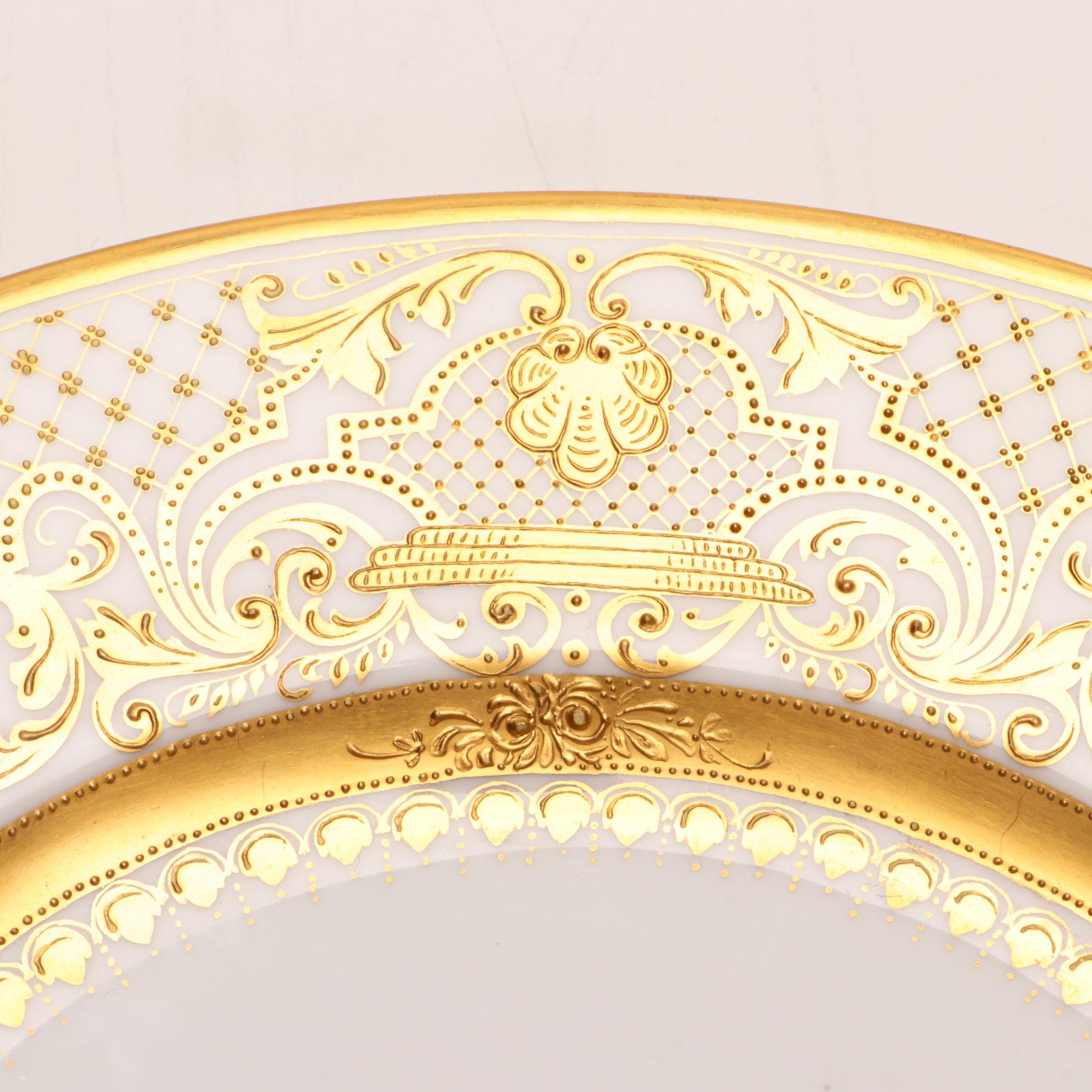 Assorted Gold and White Dinnerware Featuring Limoges and Royal Worcester