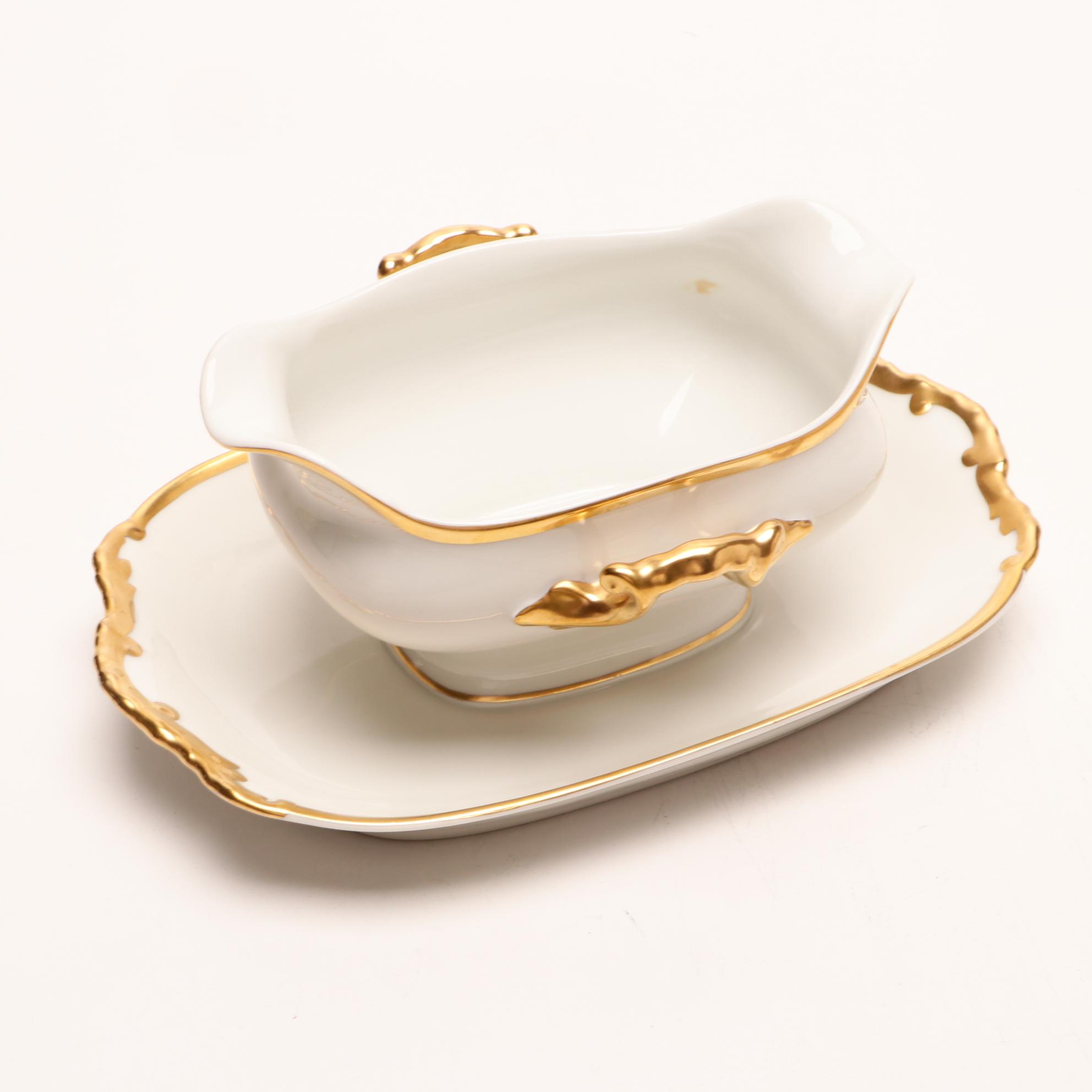 Assorted Gold and White Dinnerware Featuring Limoges and Royal Worcester