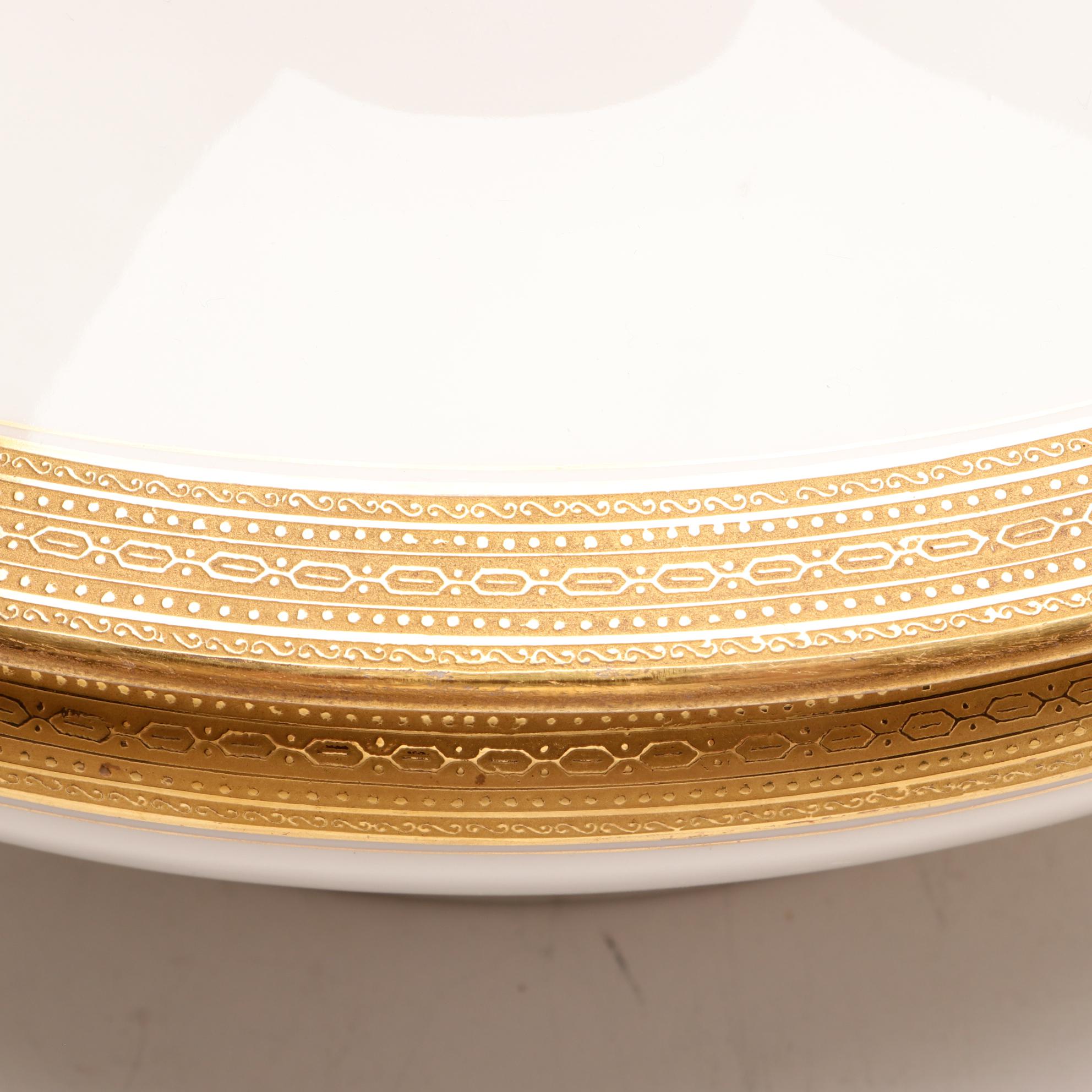 Assorted Gold and White Dinnerware Featuring Limoges and Royal Worcester