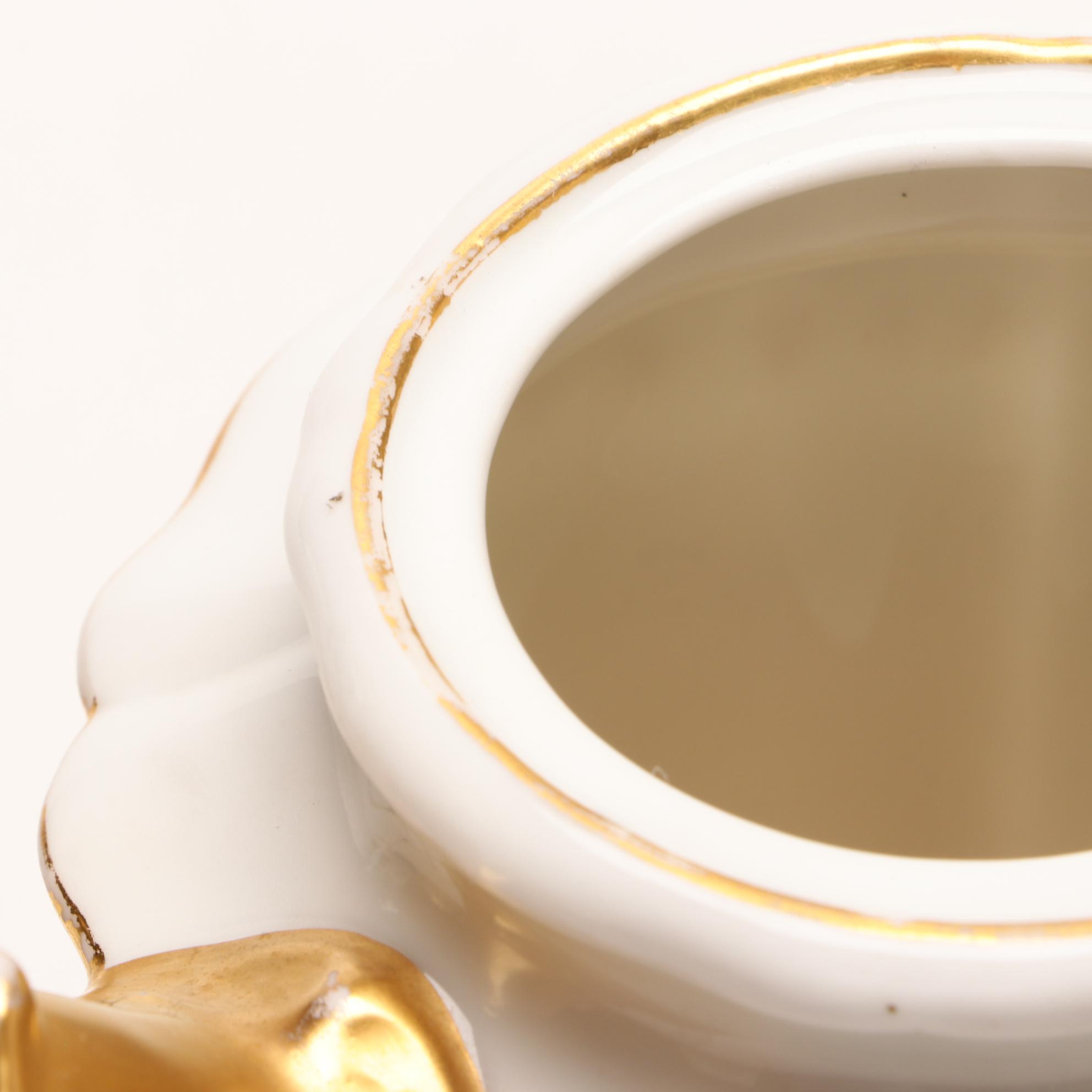 Assorted Gold and White Dinnerware Featuring Limoges and Royal Worcester