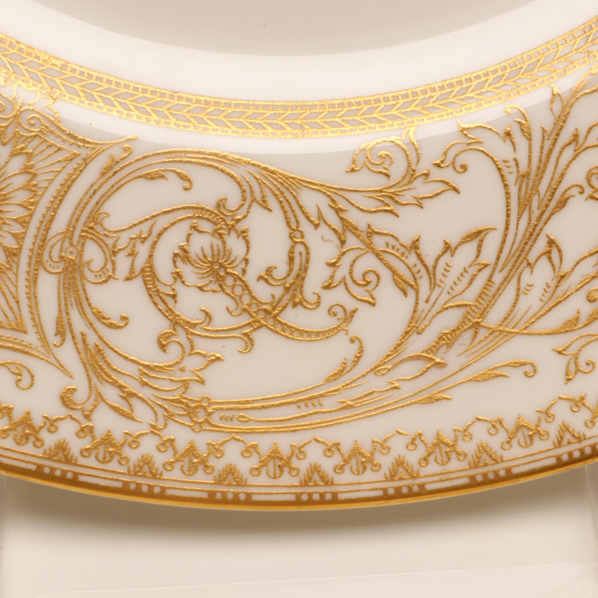 Assorted Gold and White Dinnerware Featuring Limoges and Royal Worcester