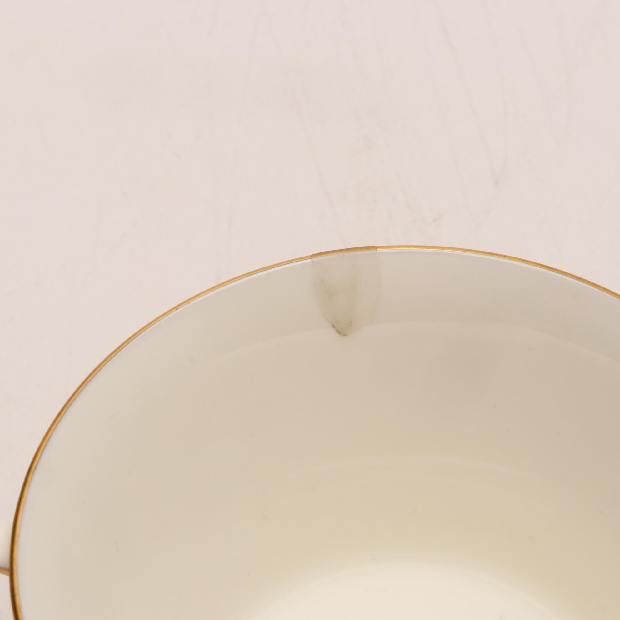 Assorted Gold and White Dinnerware Featuring Limoges and Royal Worcester