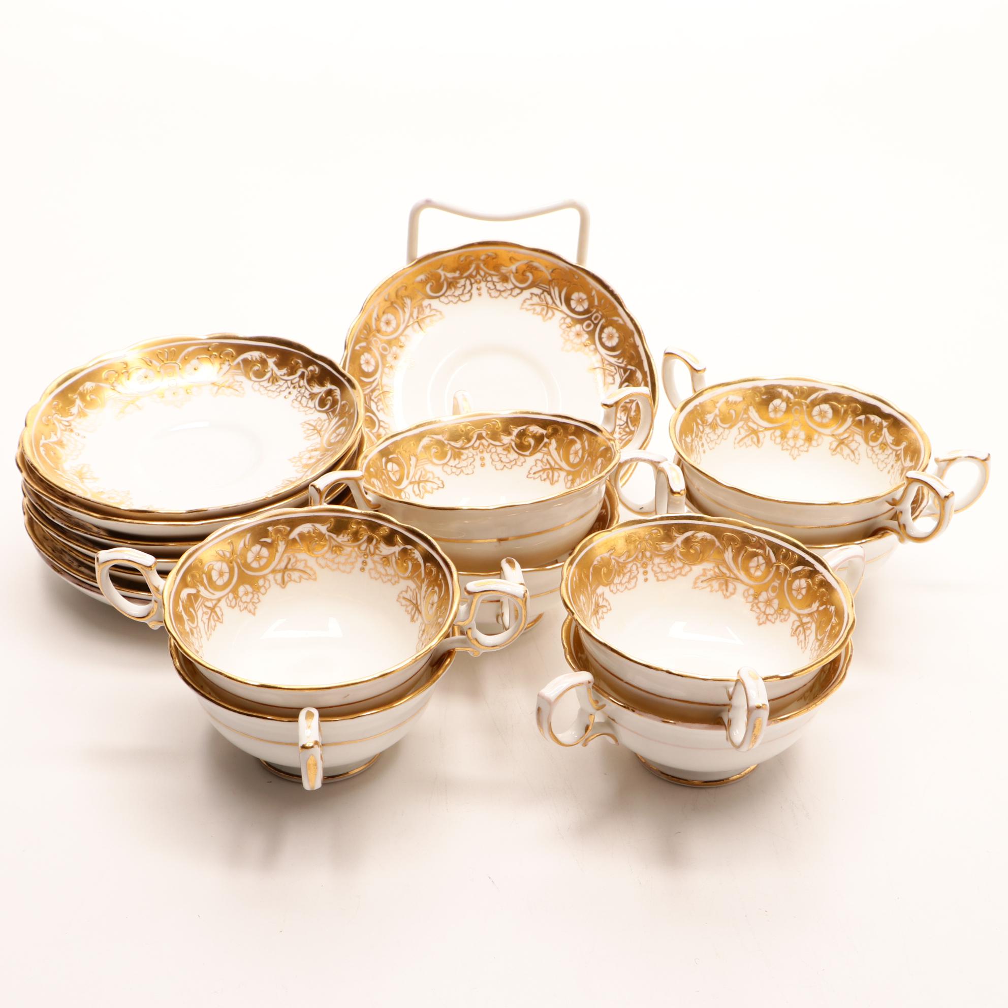 Assorted Gold and White Dinnerware Featuring Limoges and Royal Worcester
