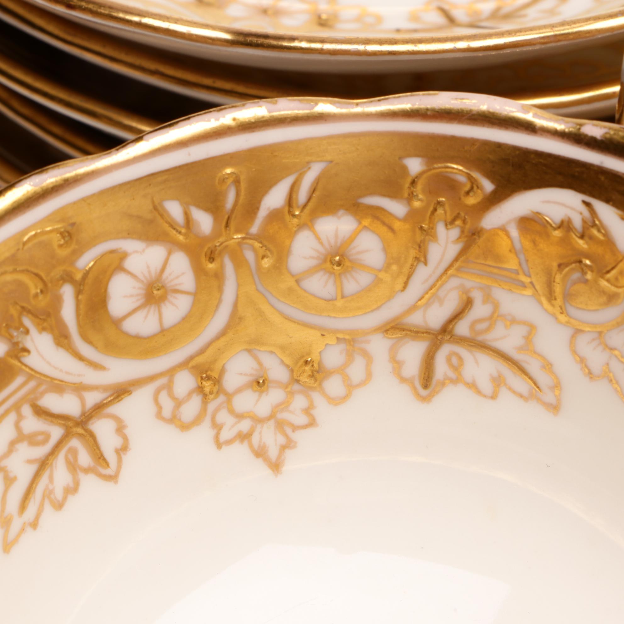 Assorted Gold and White Dinnerware Featuring Limoges and Royal Worcester
