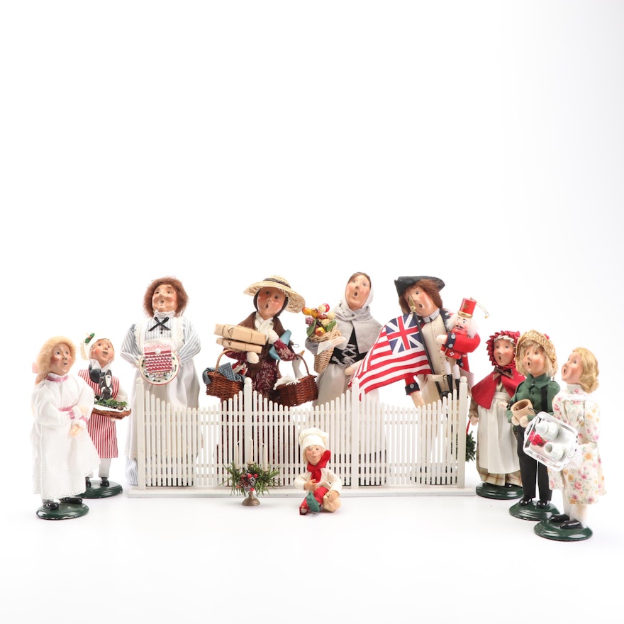 Byers' Choice Carolers and Fence Featuring Signed Caroler and First Edition