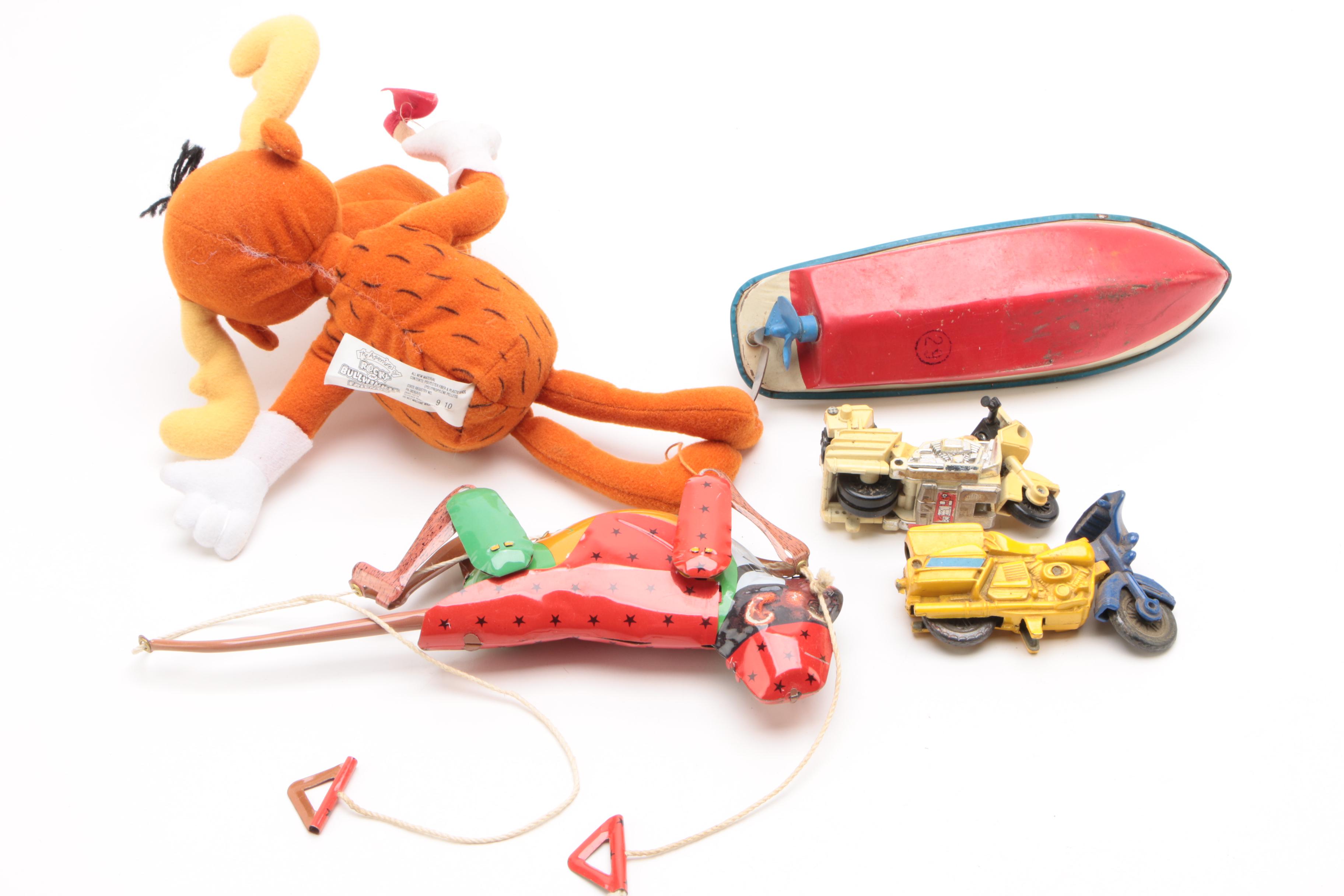 Vintage Tin Wind-Up Toys Including a Rolling Cat and "Tailspin Pup"