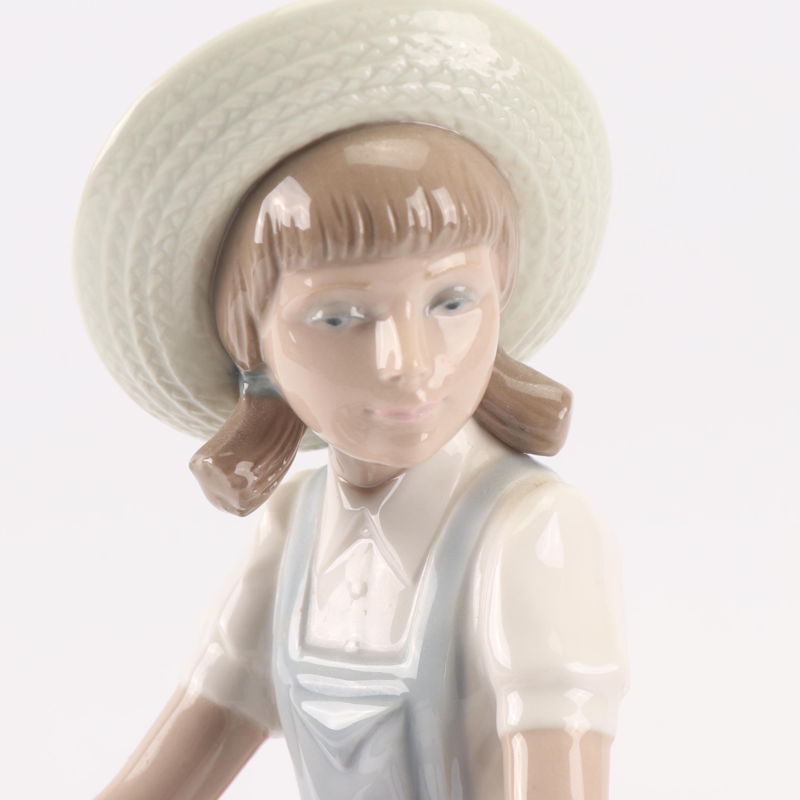 Lladró "Girl with Flowers in Tow" Porcelain Figurine
