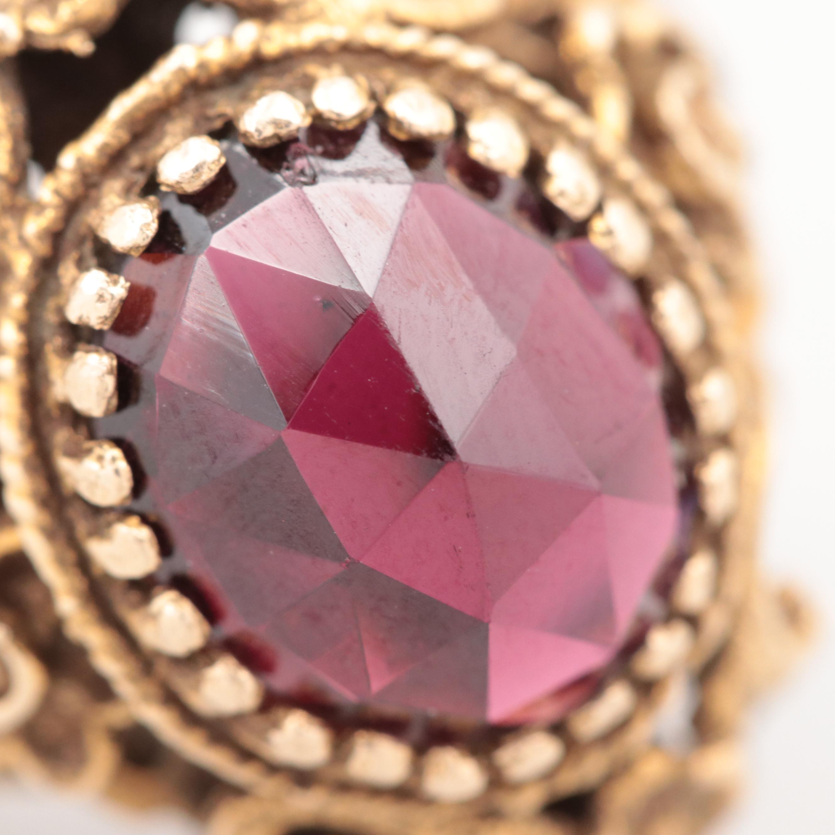 Vintage 14K Yellow Gold Garnet Ring with Baroque Motif