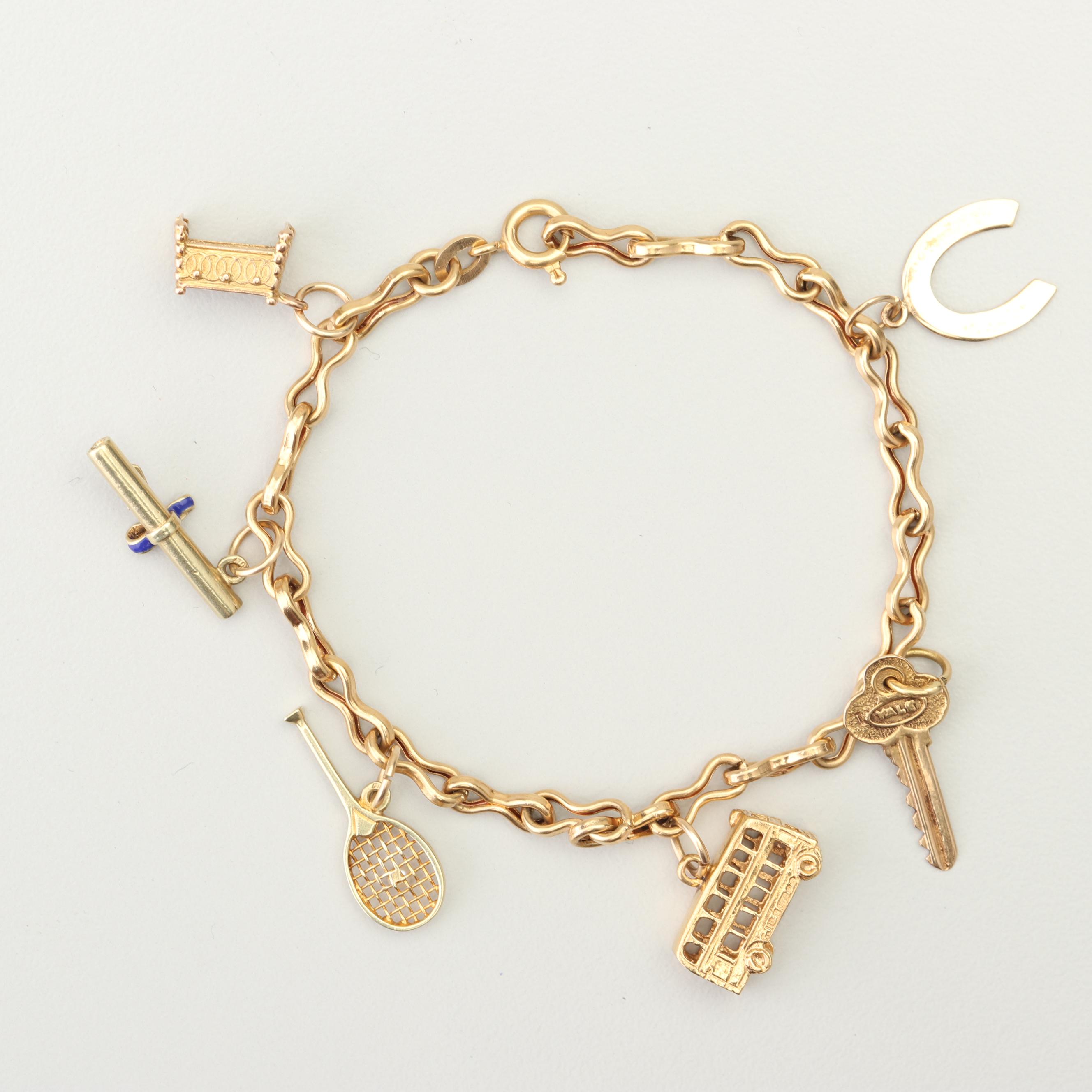 18K Yellow Gold Charm Bracelet with 14K and 10K Yellow Gold Charms