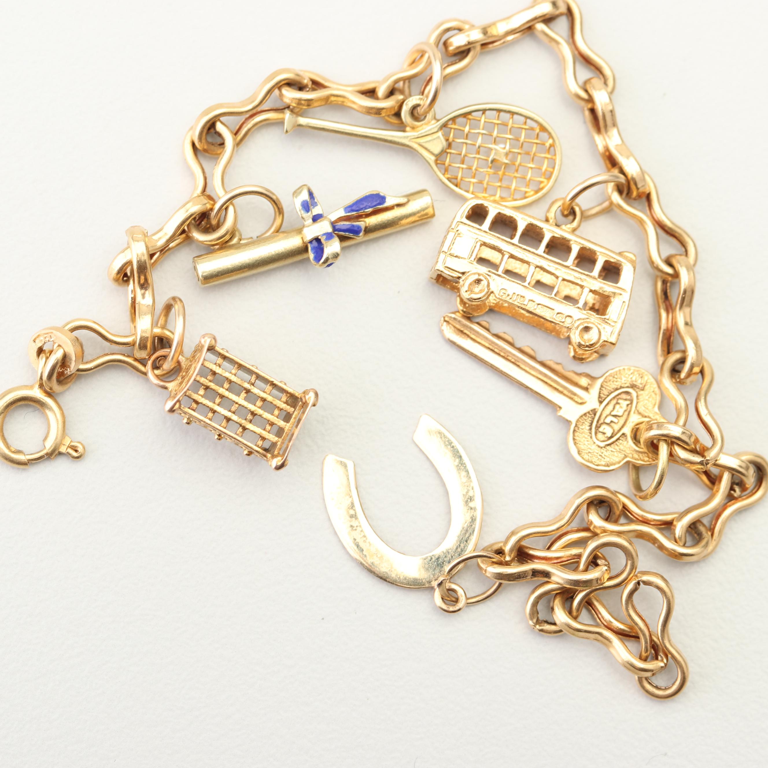 18K Yellow Gold Charm Bracelet with 14K and 10K Yellow Gold Charms