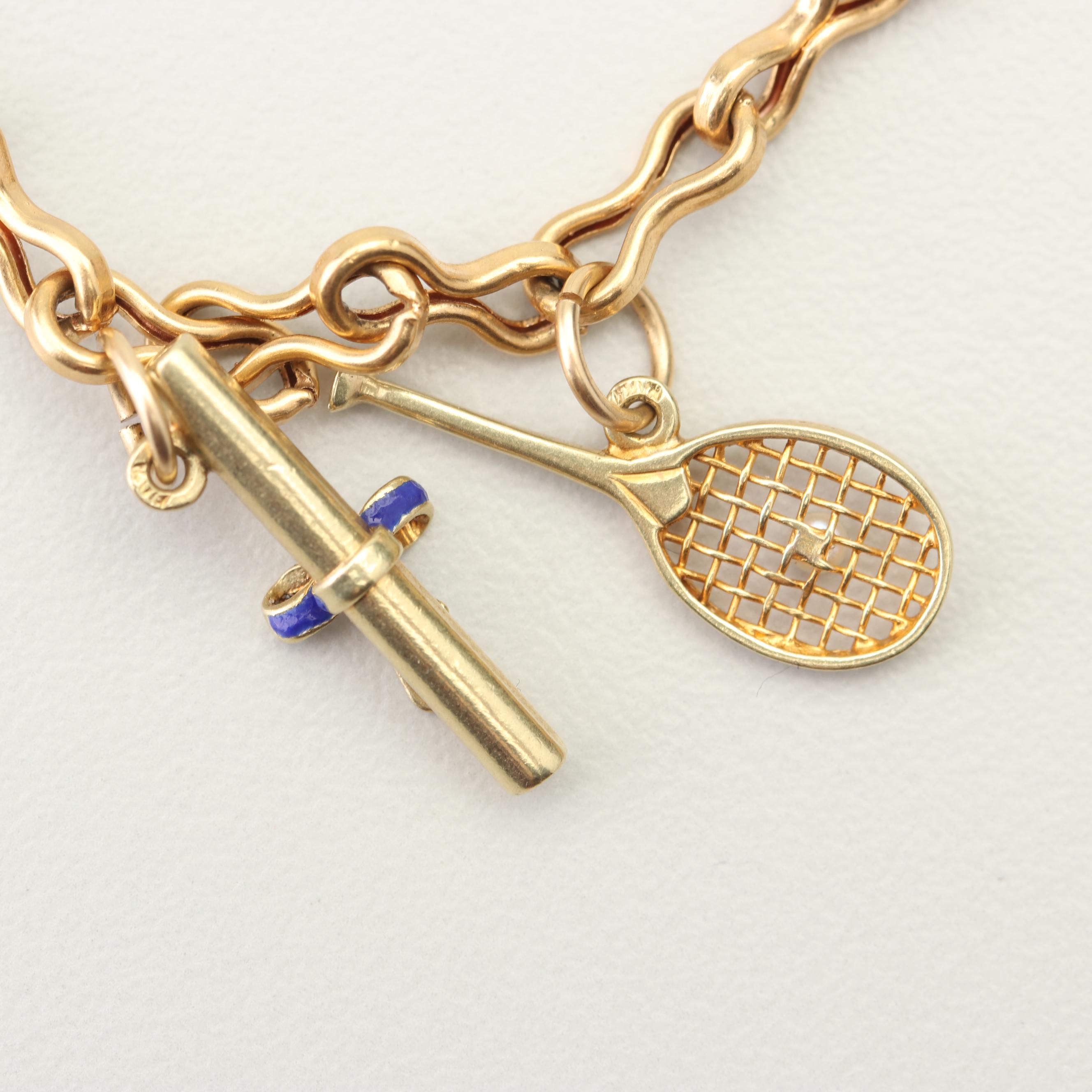 18K Yellow Gold Charm Bracelet with 14K and 10K Yellow Gold Charms