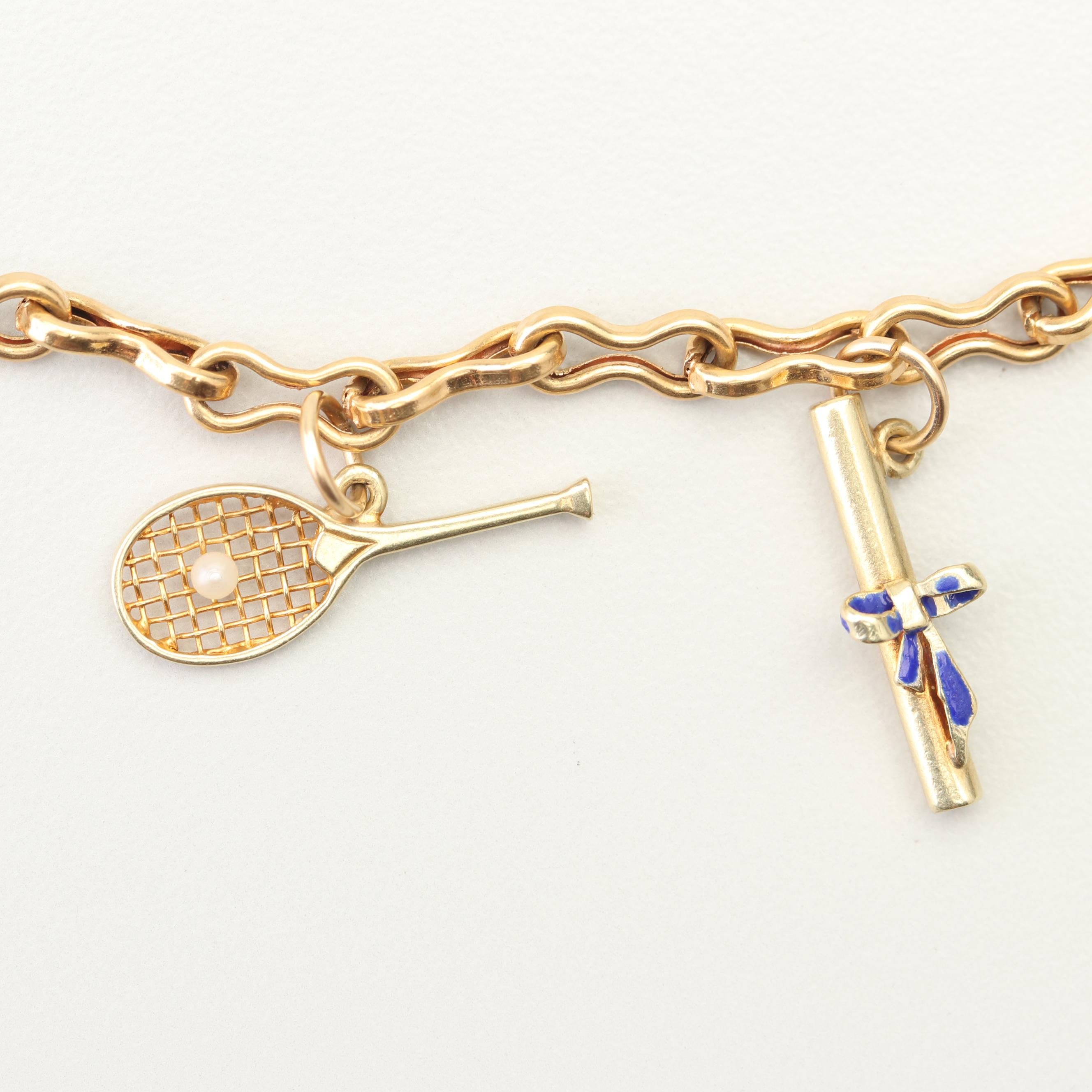 18K Yellow Gold Charm Bracelet with 14K and 10K Yellow Gold Charms